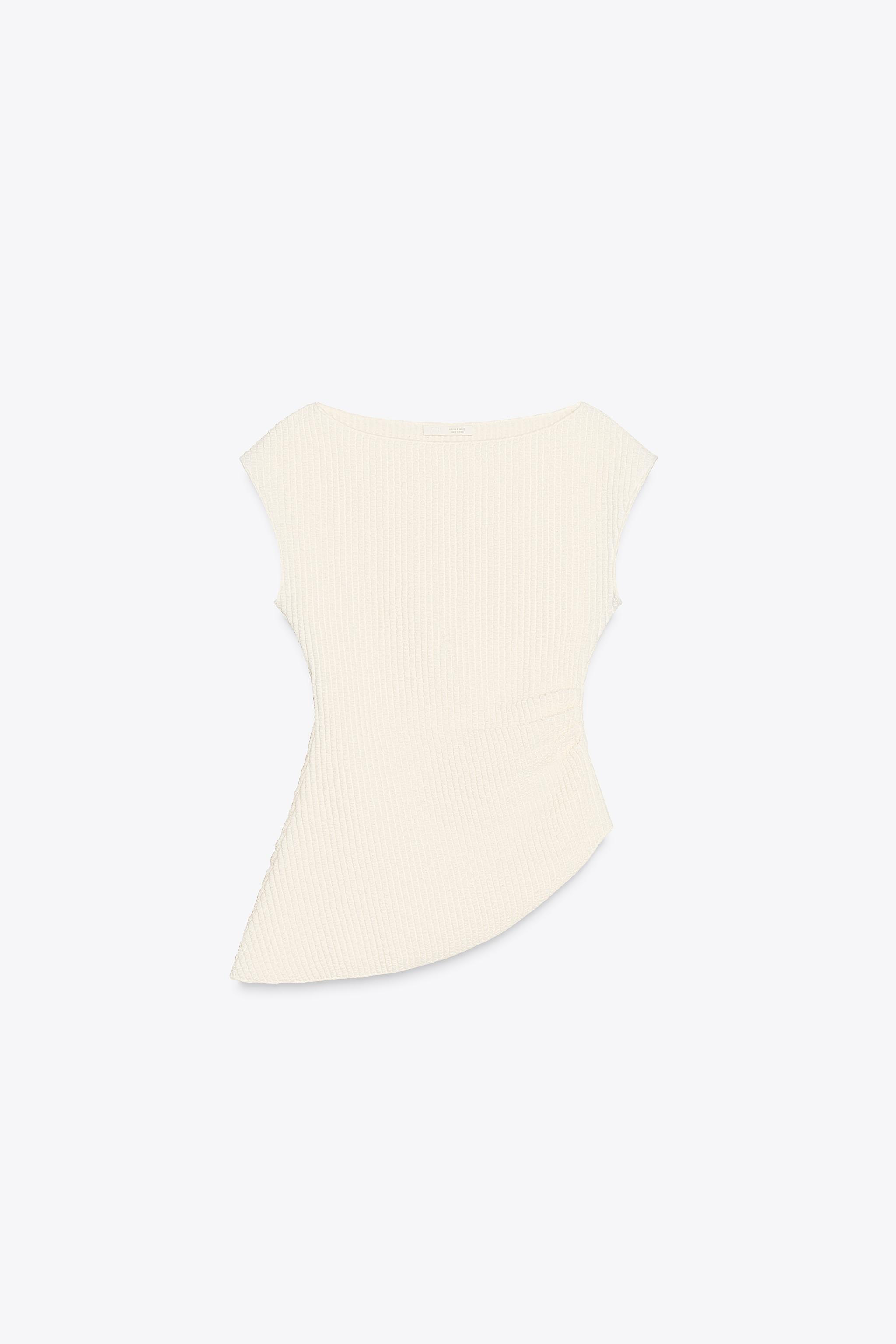 Asymmetric textured top