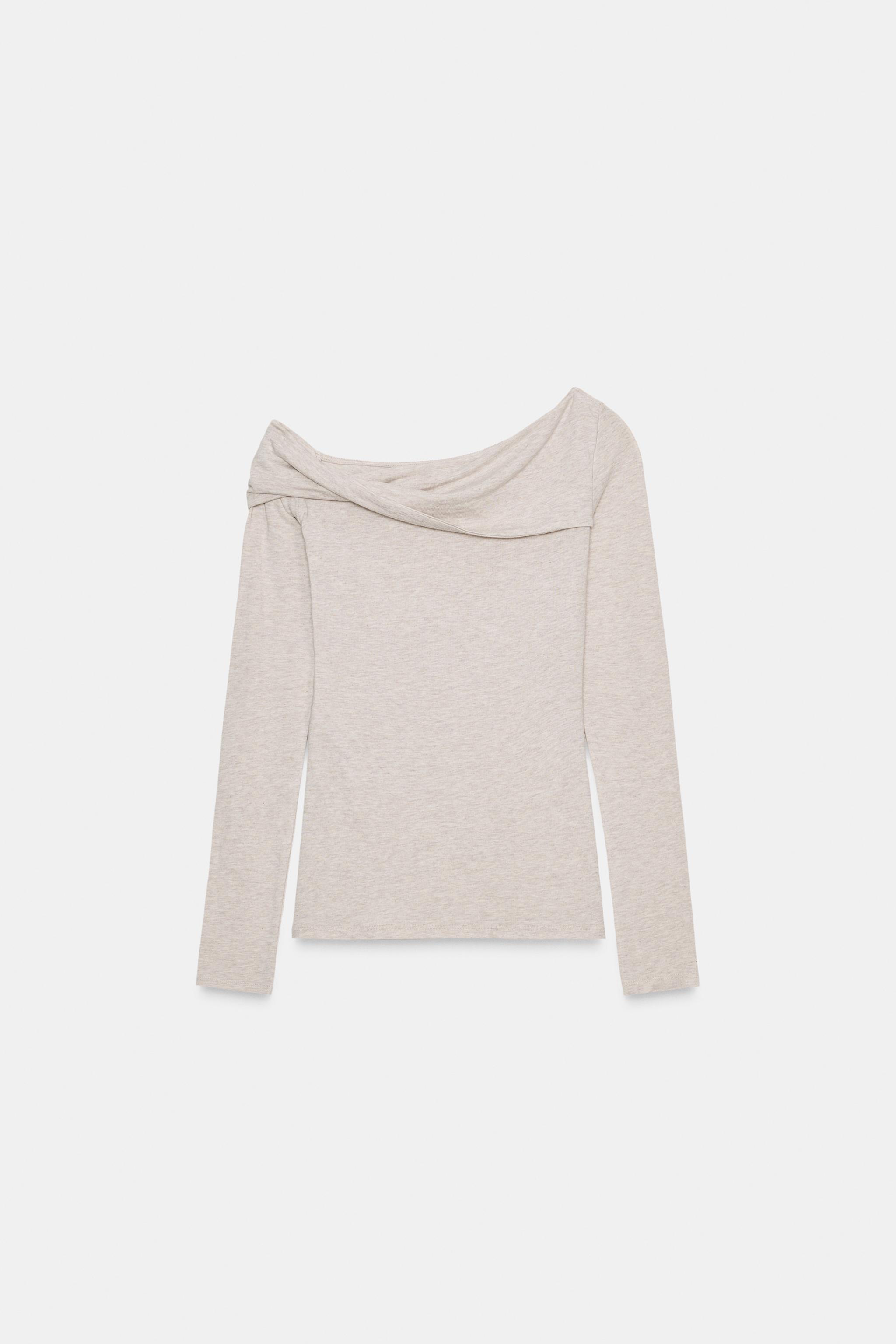 Asymmetric neck top