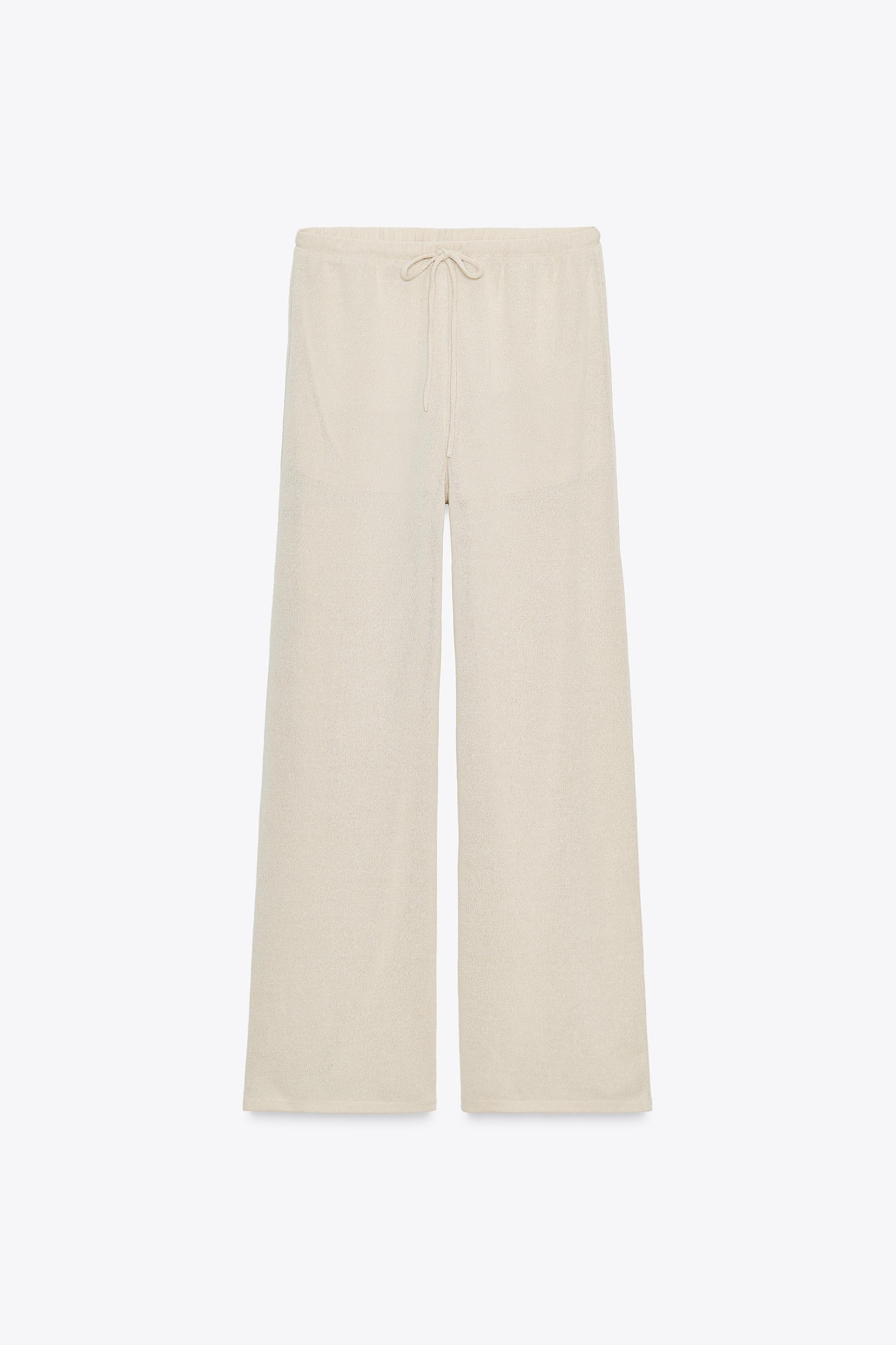 Knit trousers with slit