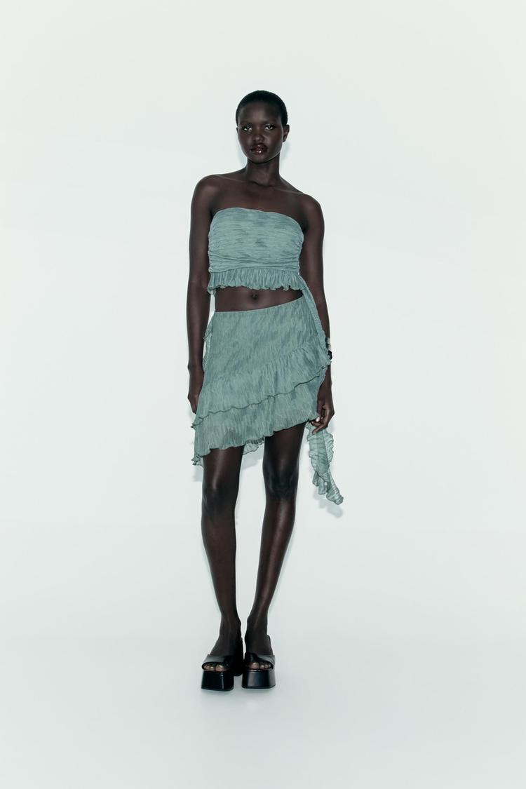 PLEATED SKIRT WITH RUFFLES