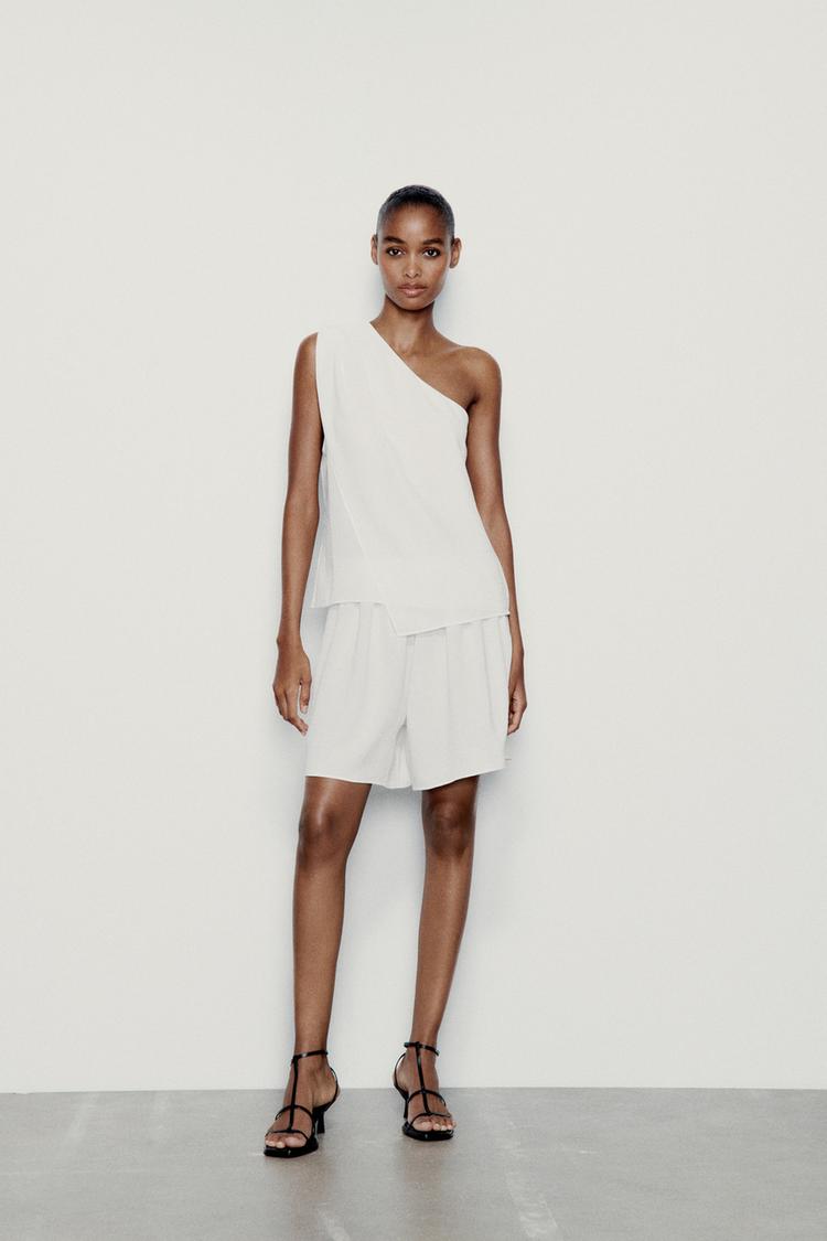 ASYMMETRIC FLOWING TOP