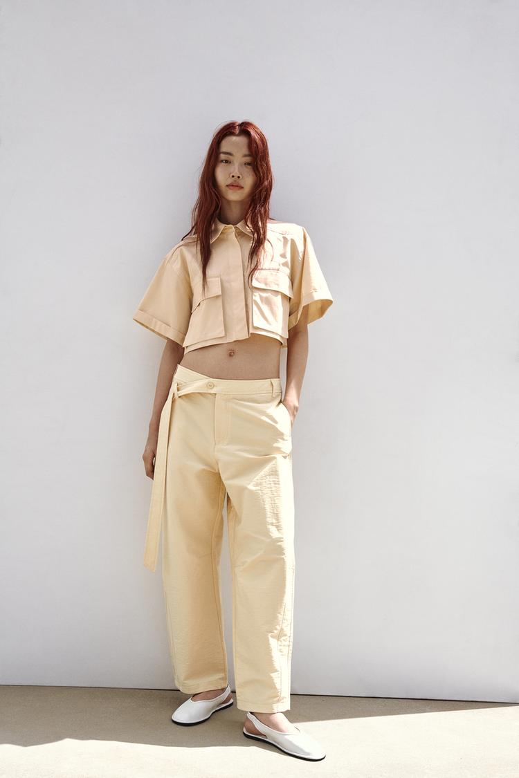 CARROT FIT TROUSERS WITH ASYMMETRIC BELT