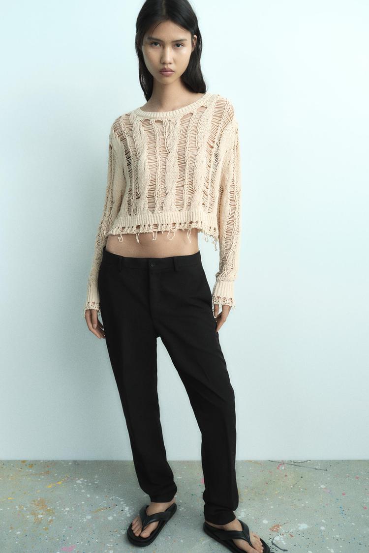 RIPPED KNIT SWEATER