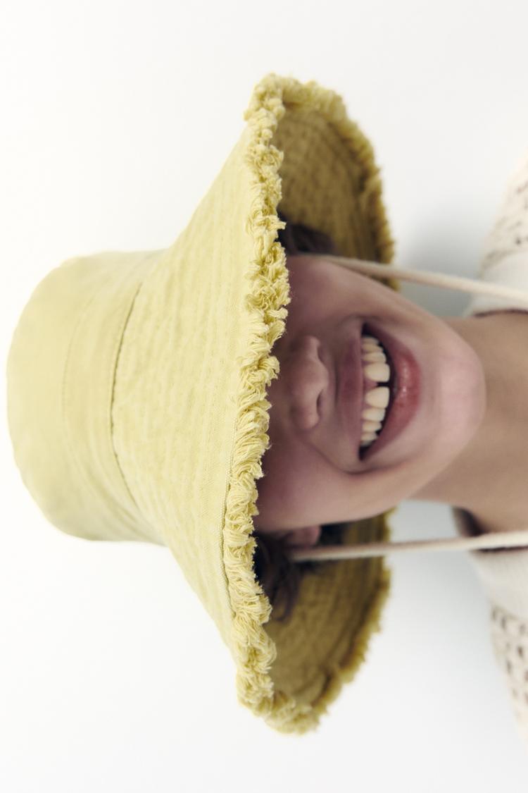 FRAYED BUCKET HAT WITH DRAWSTRING
