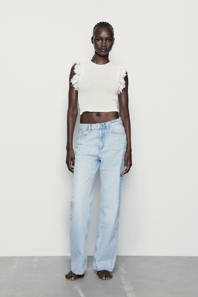 TEXTURED TOP WITH RUFFLE TRIMS