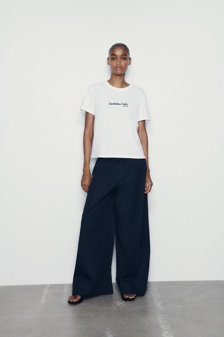 T-SHIRT WITH SLOGAN