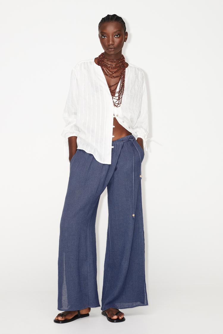 WIDE-LEG WRAP TROUSERS WITH SIDE OPENINGS