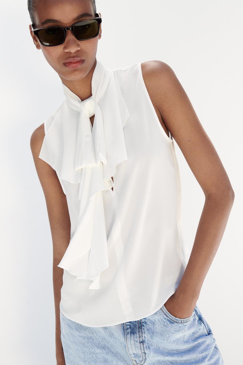 White Ribe Ruffles White Sleeveless Ruffle Blouse