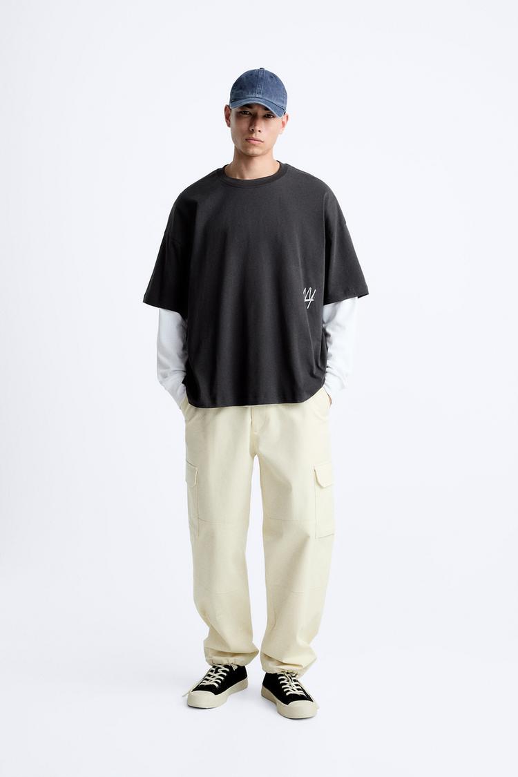 T-SHIRT WITH PRINTED SLOGAN