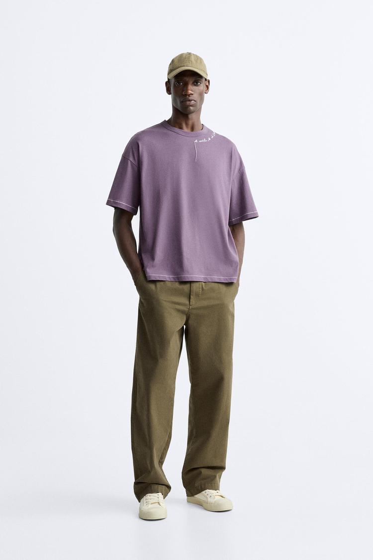 T-SHIRT WITH EMBROIDERED SLOGAN