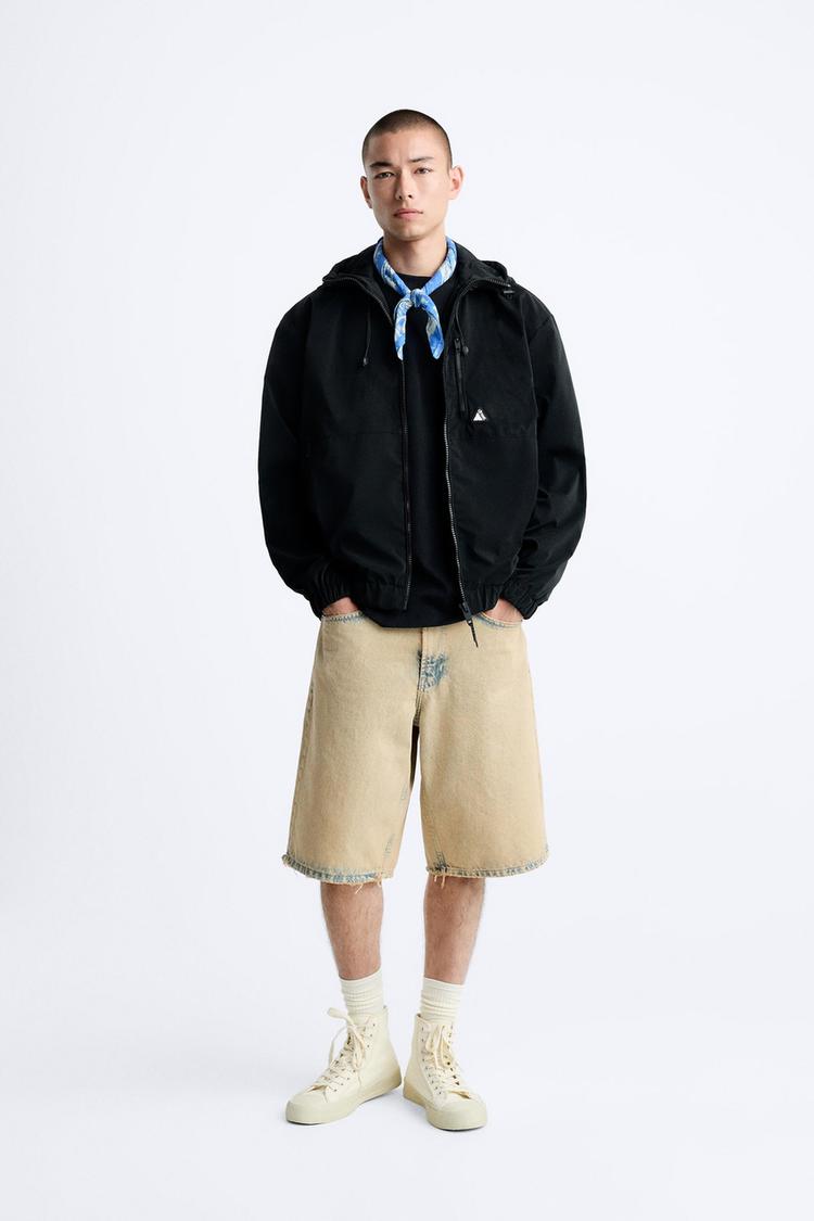 HOODED TECHNICAL JACKET