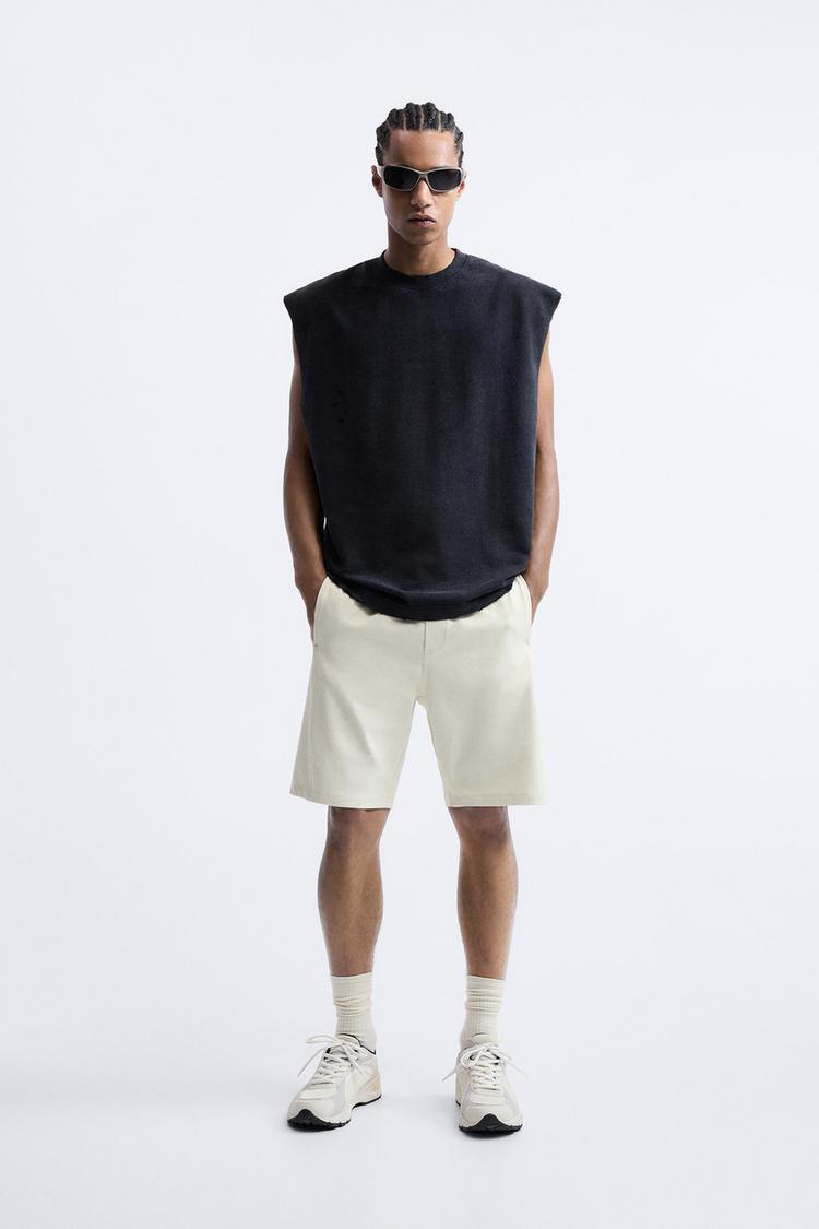 BERMUDA SHORTS WITH ZIPPED POCKETS