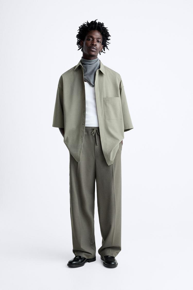 TROUSERS WITH CONTRAST PIPING