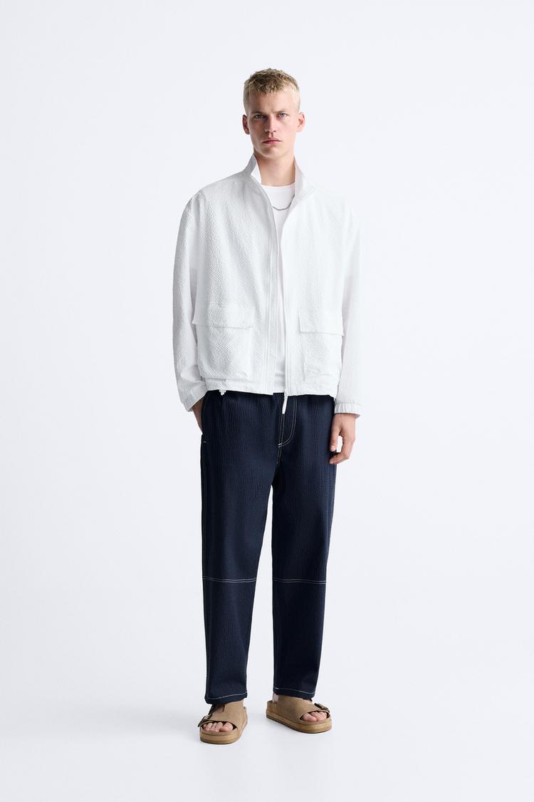 SEERSUCKER TROUSERS WITH CONTRAST TOPSTITCHING