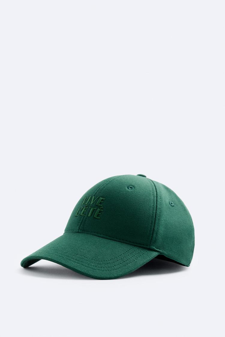 CAP WITH EMBROIDERED SLOGAN