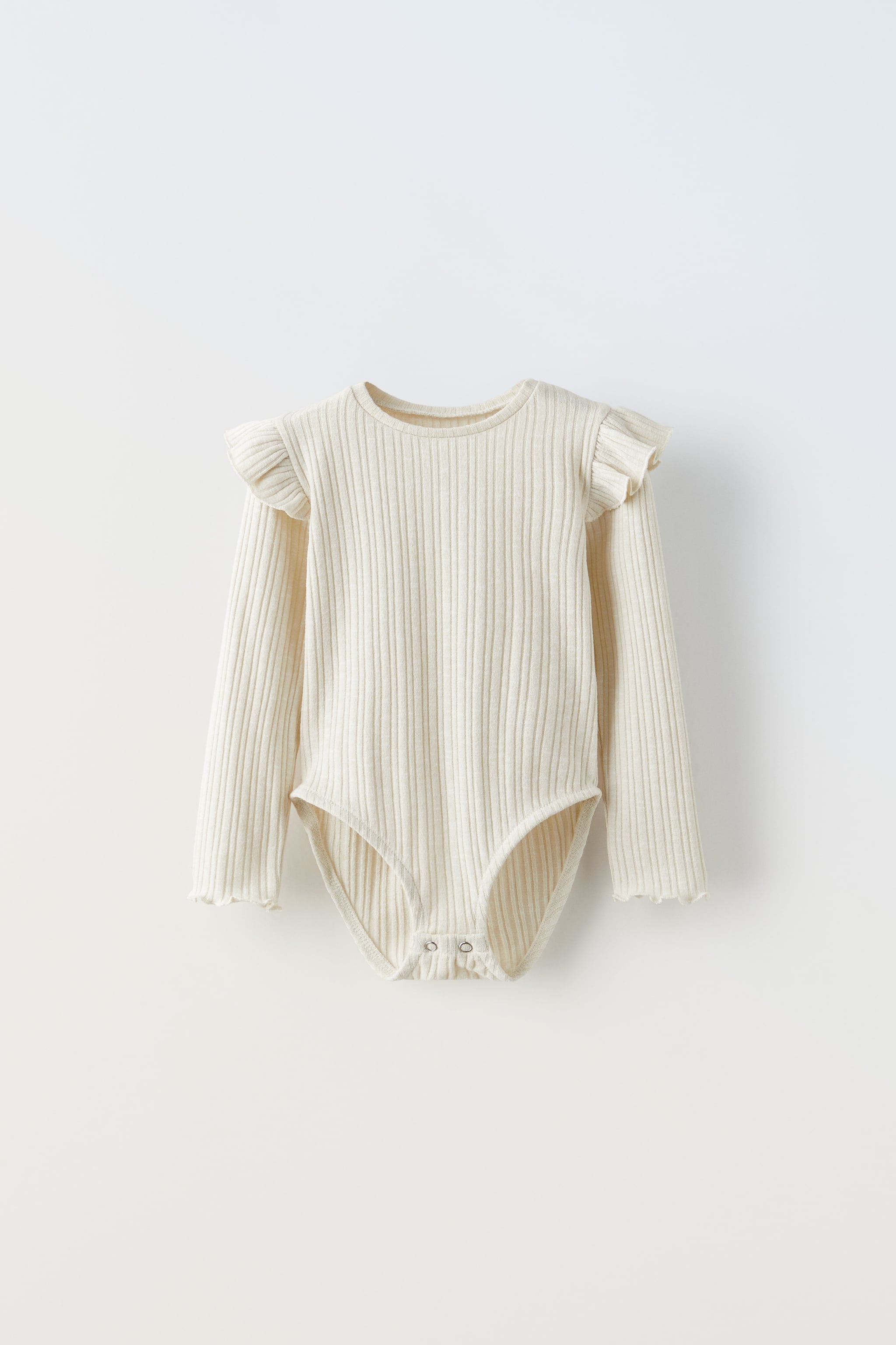 RIBBED BODYSUIT WITH RUFFLES