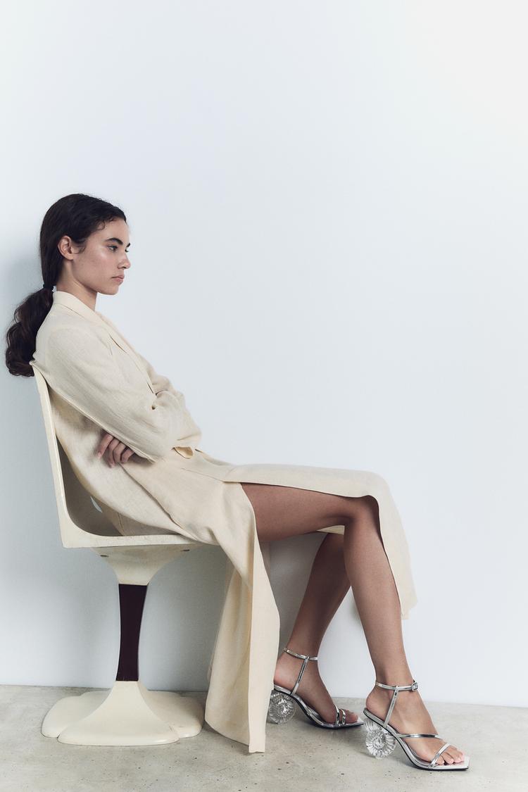 METALLIC SANDAL WITH SEASHELL HEEL