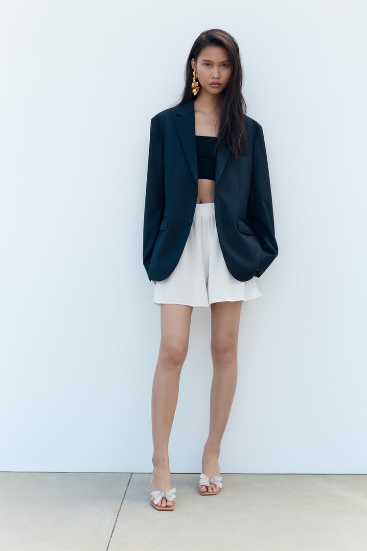 HEELED VINYL SANDALS WITH BOW