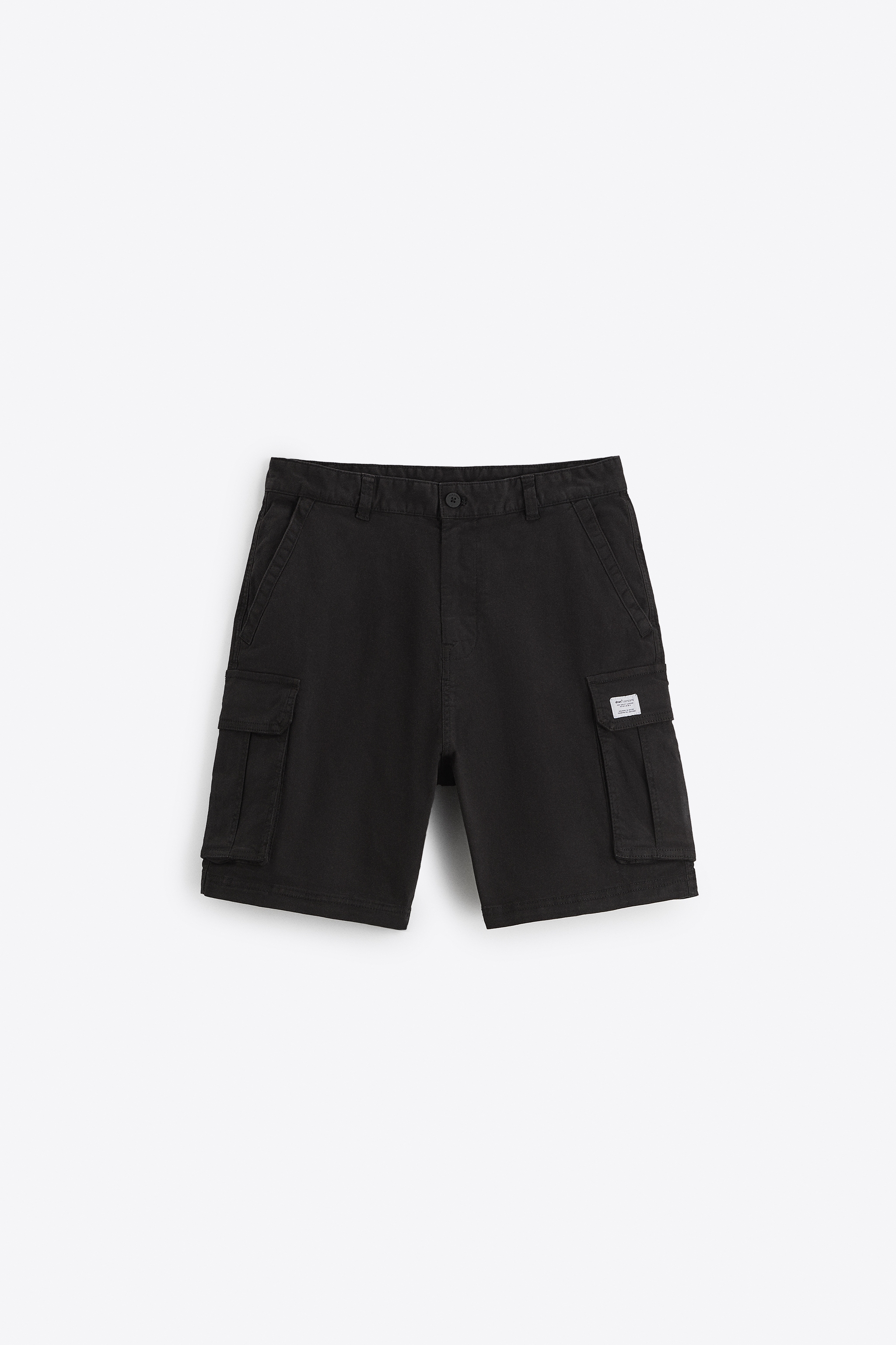 Elastic waistband shorts. Front pockets and back Flap pockets. patch at legs. zip button closure.