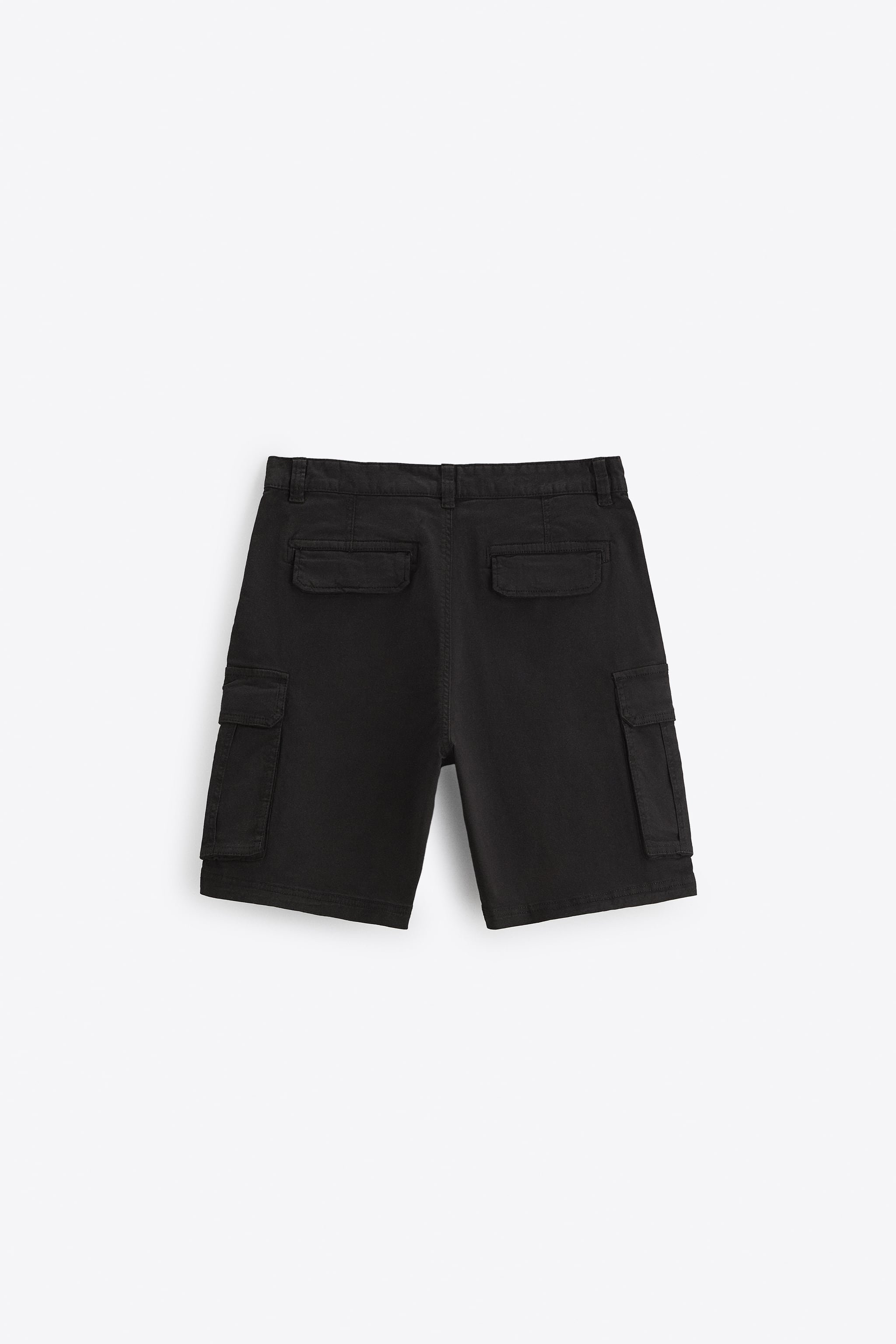 Elastic waistband shorts. Front pockets and back Flap pockets. patch at legs. zip button closure.
