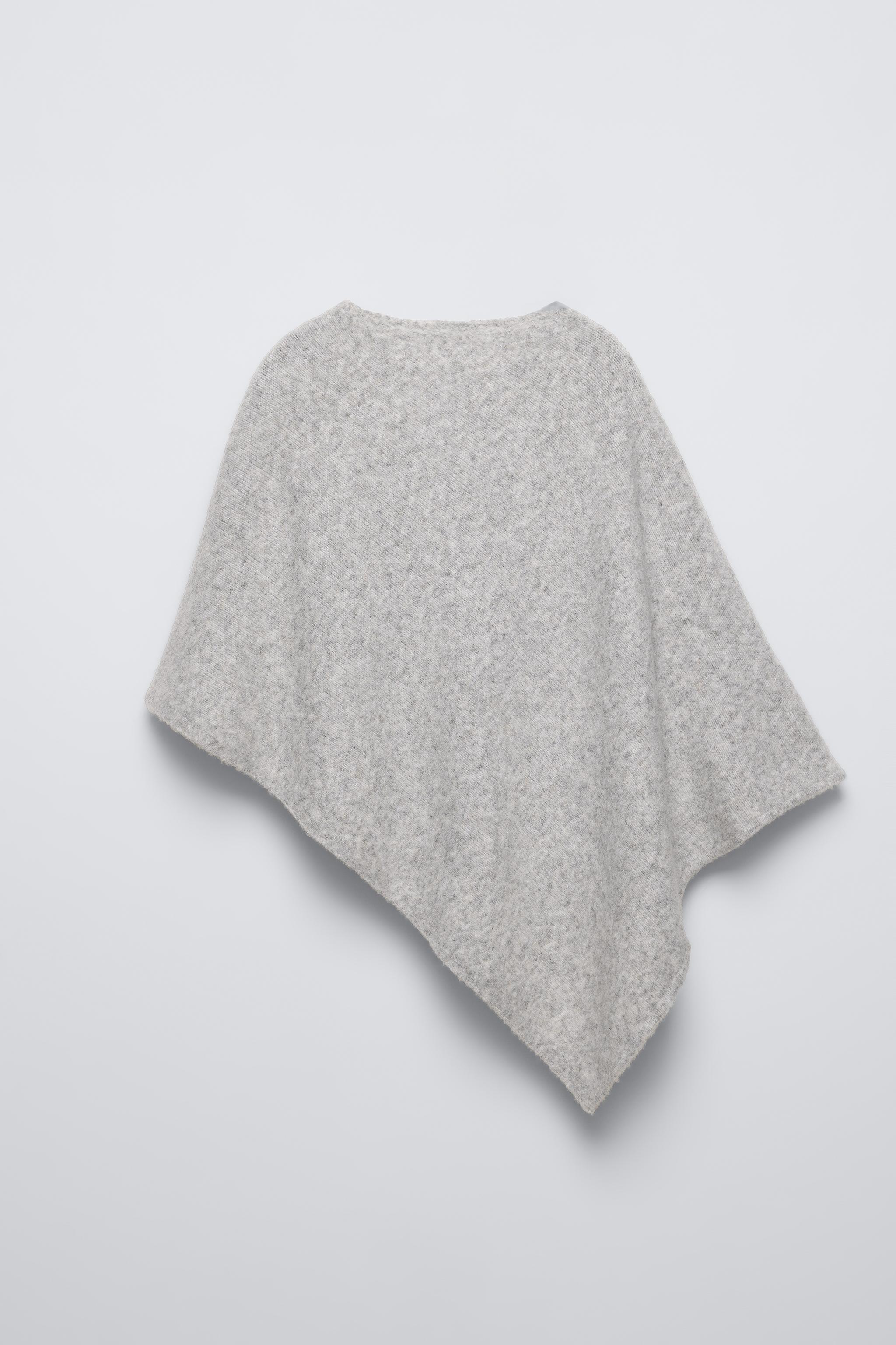 ASYMMETRIC KNIT CAPE