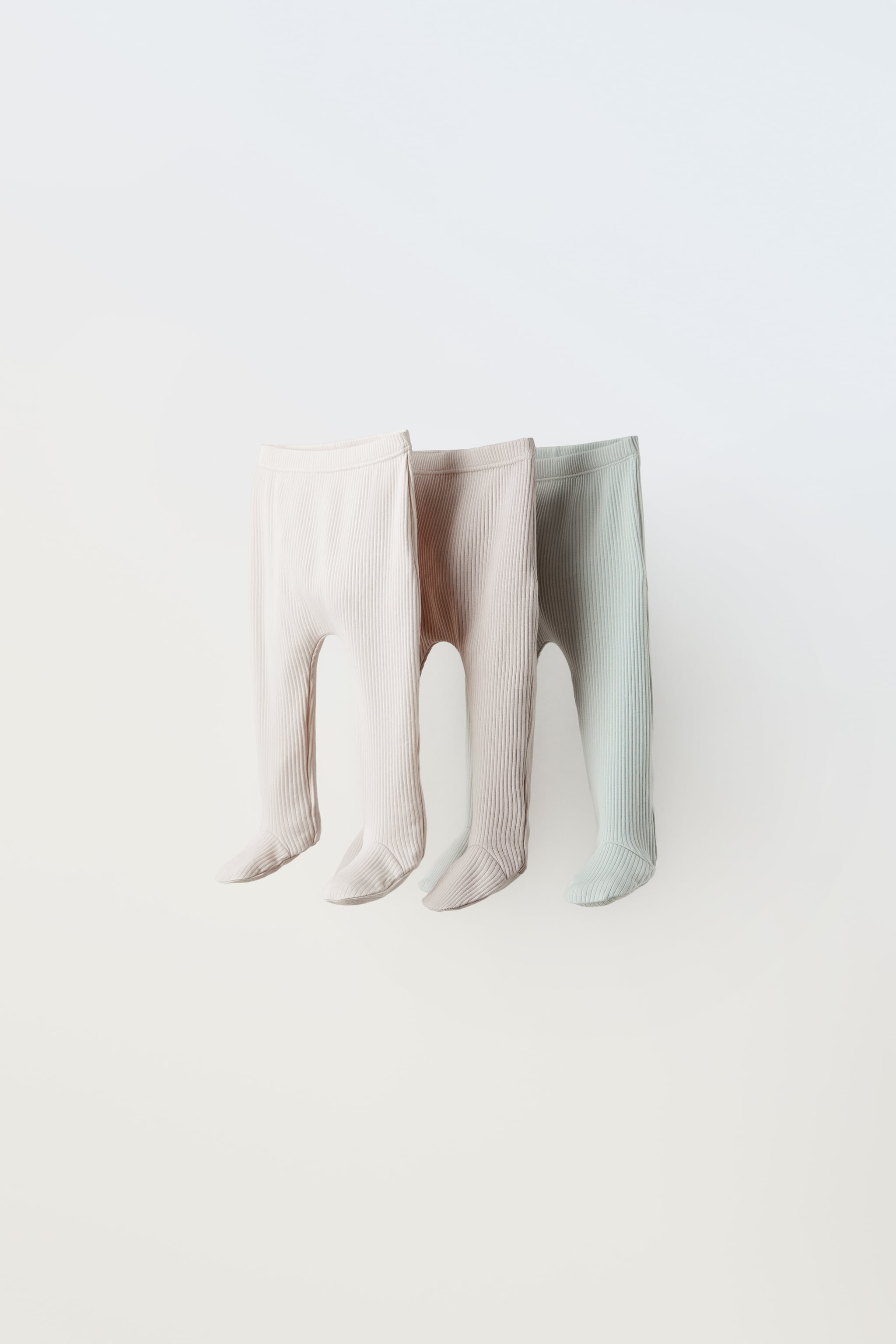 0-9 MONTHS/ THREE PACK OF RIBBED FOOTED LEGGINGS