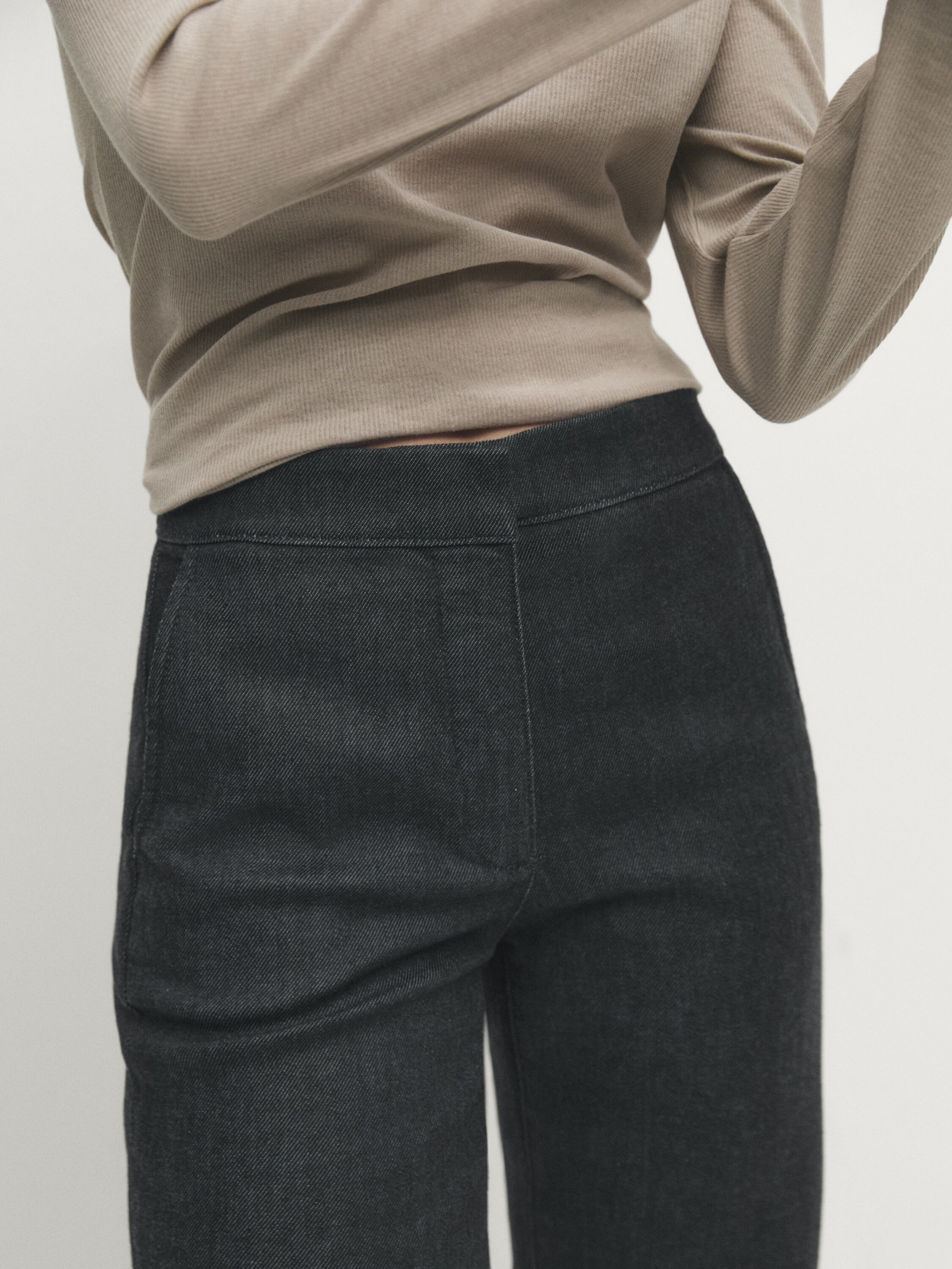 High-waist flared fit jeans with turn-up hems