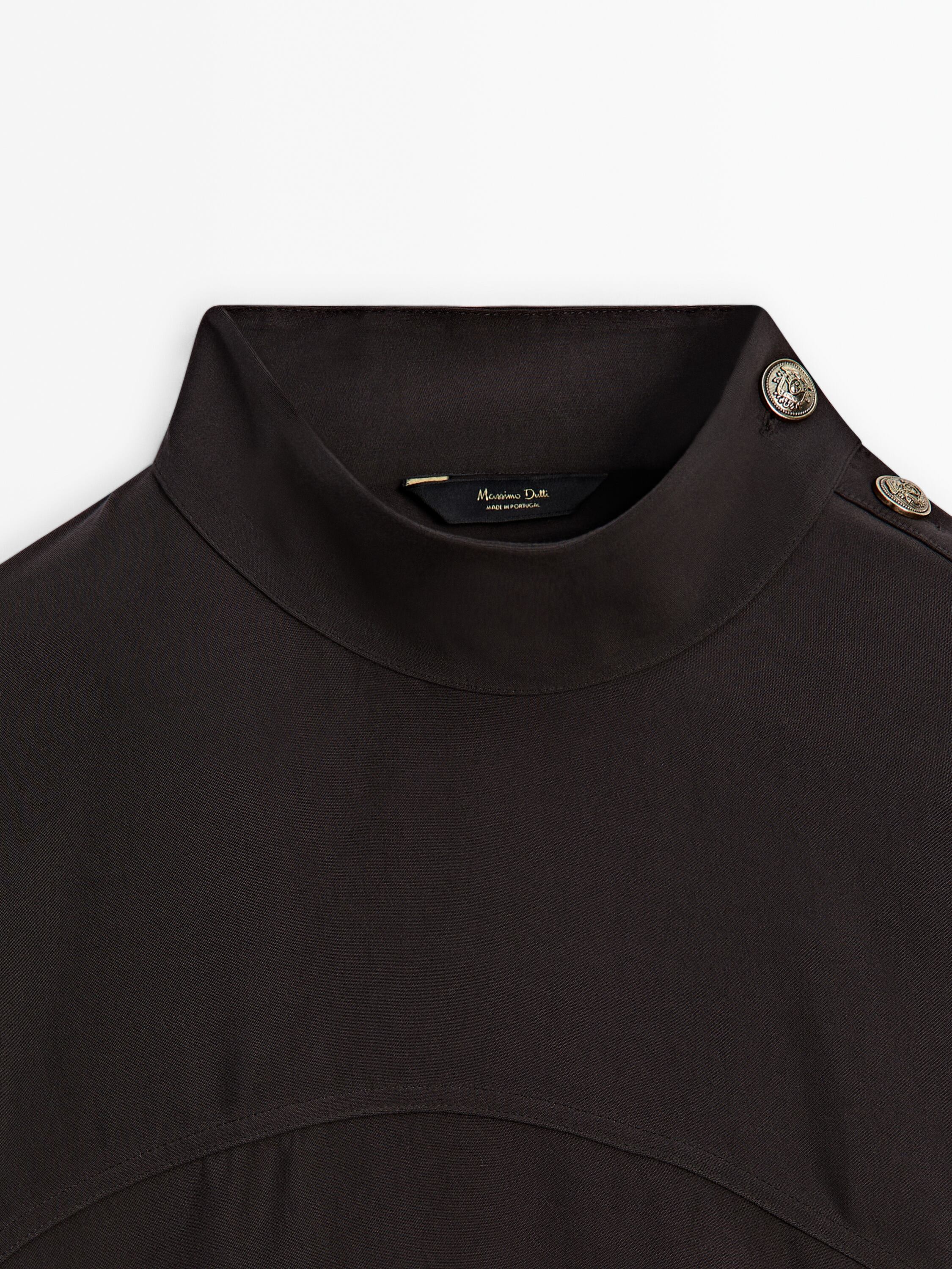 Black blouse with gold buttons