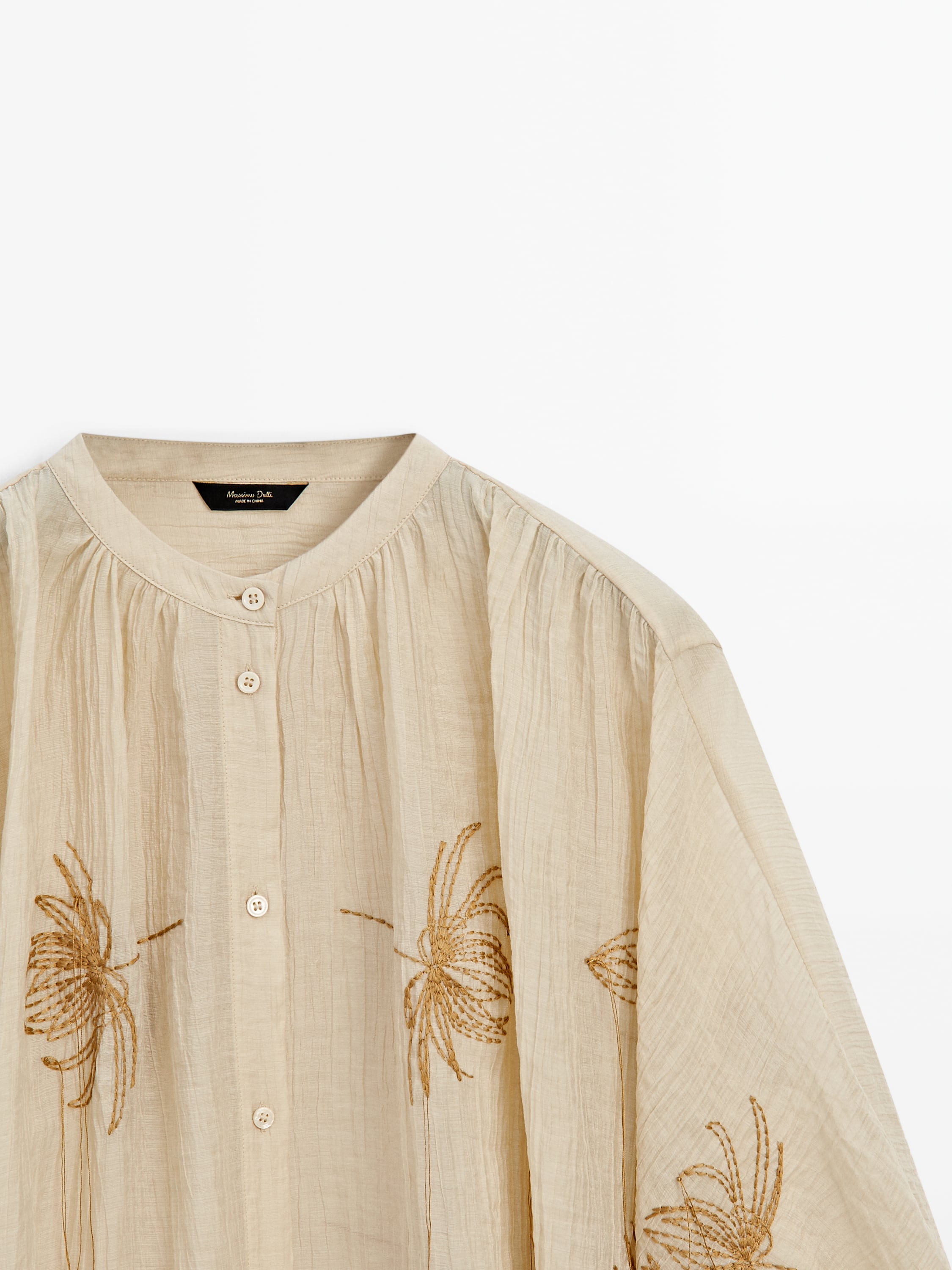 Cape shirt with embroidered detail