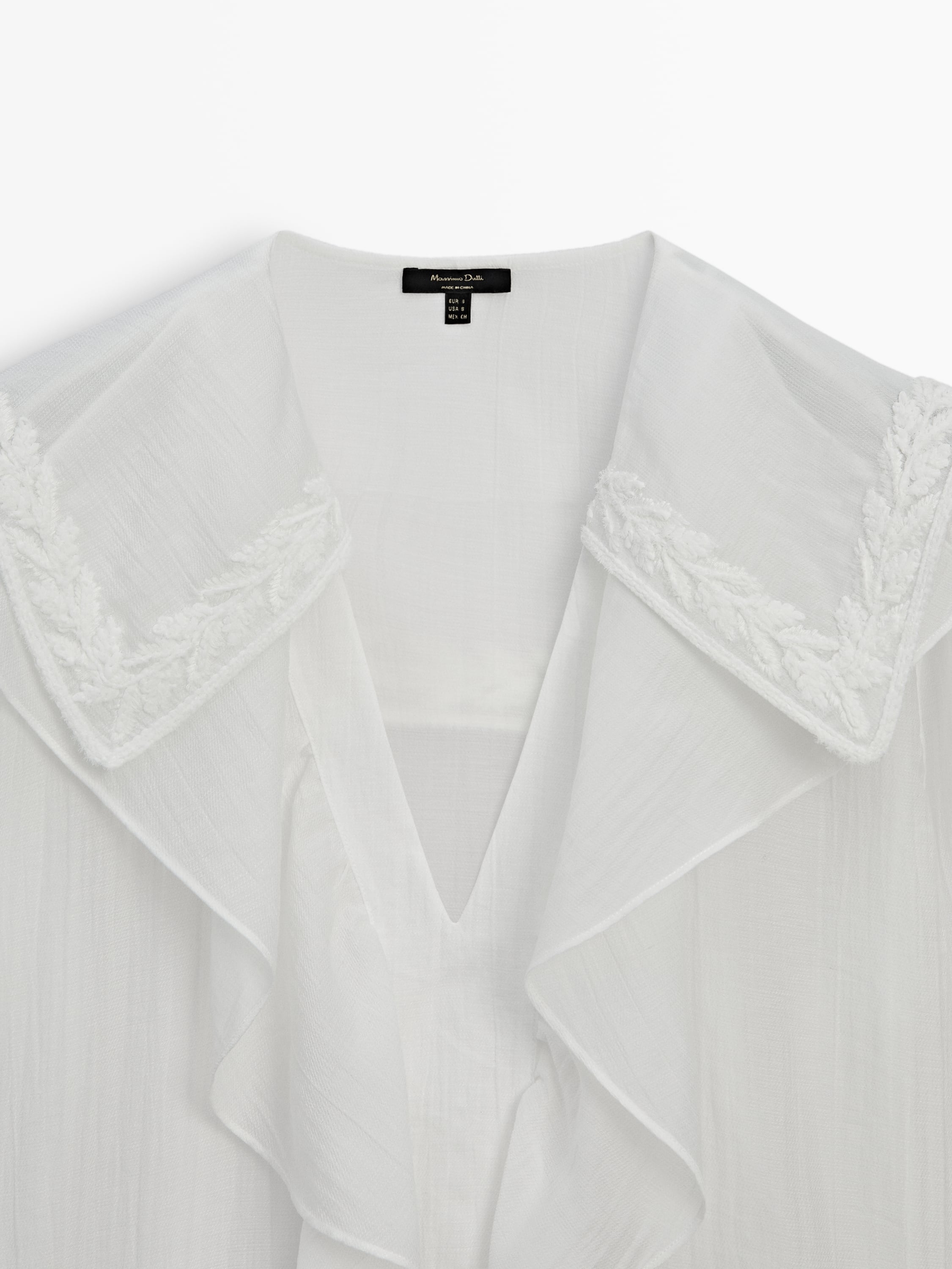 Ruffled shirt with embroidered detail