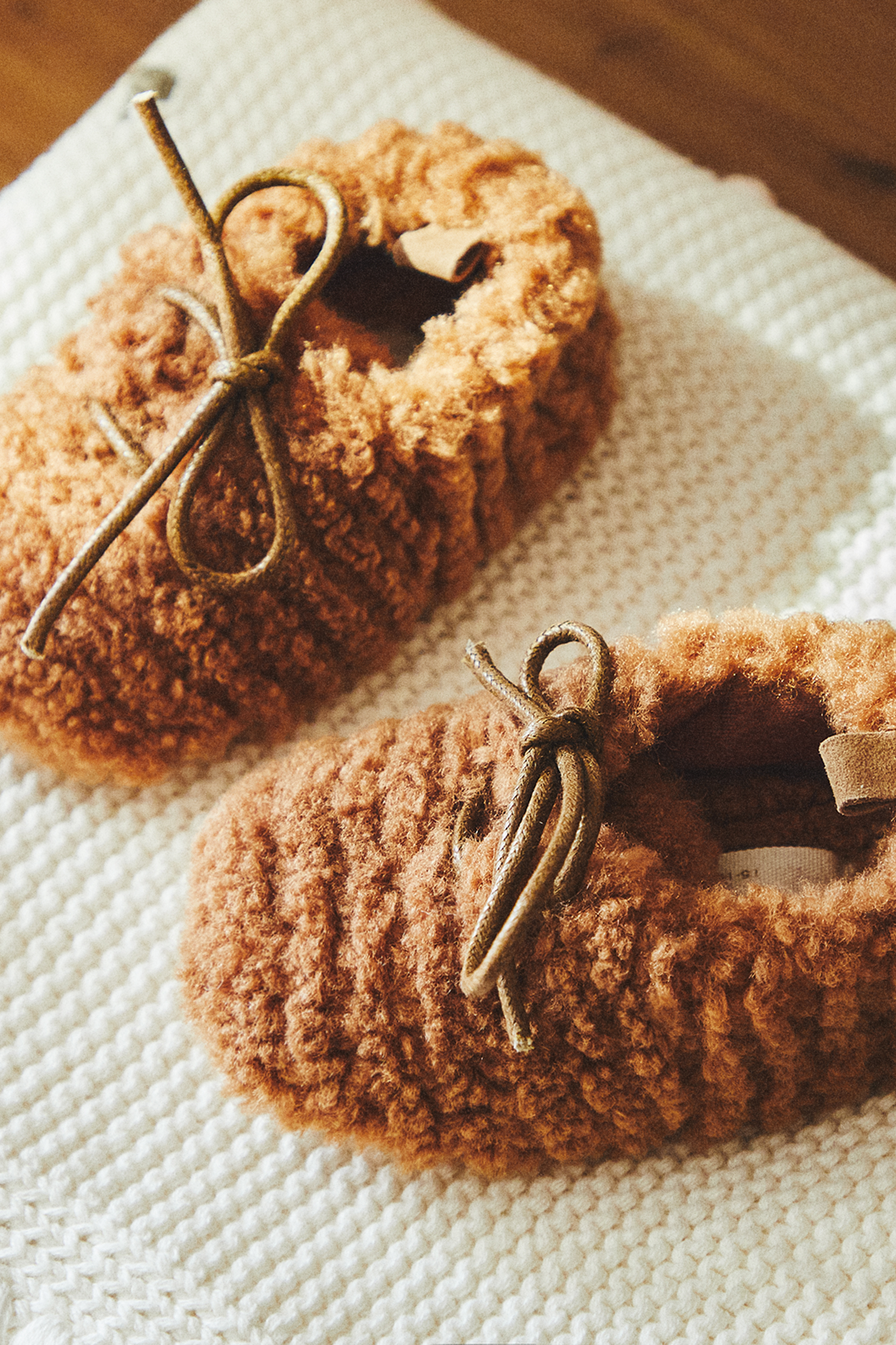 FAUX SHEARLING BOOTIES WITH BOW