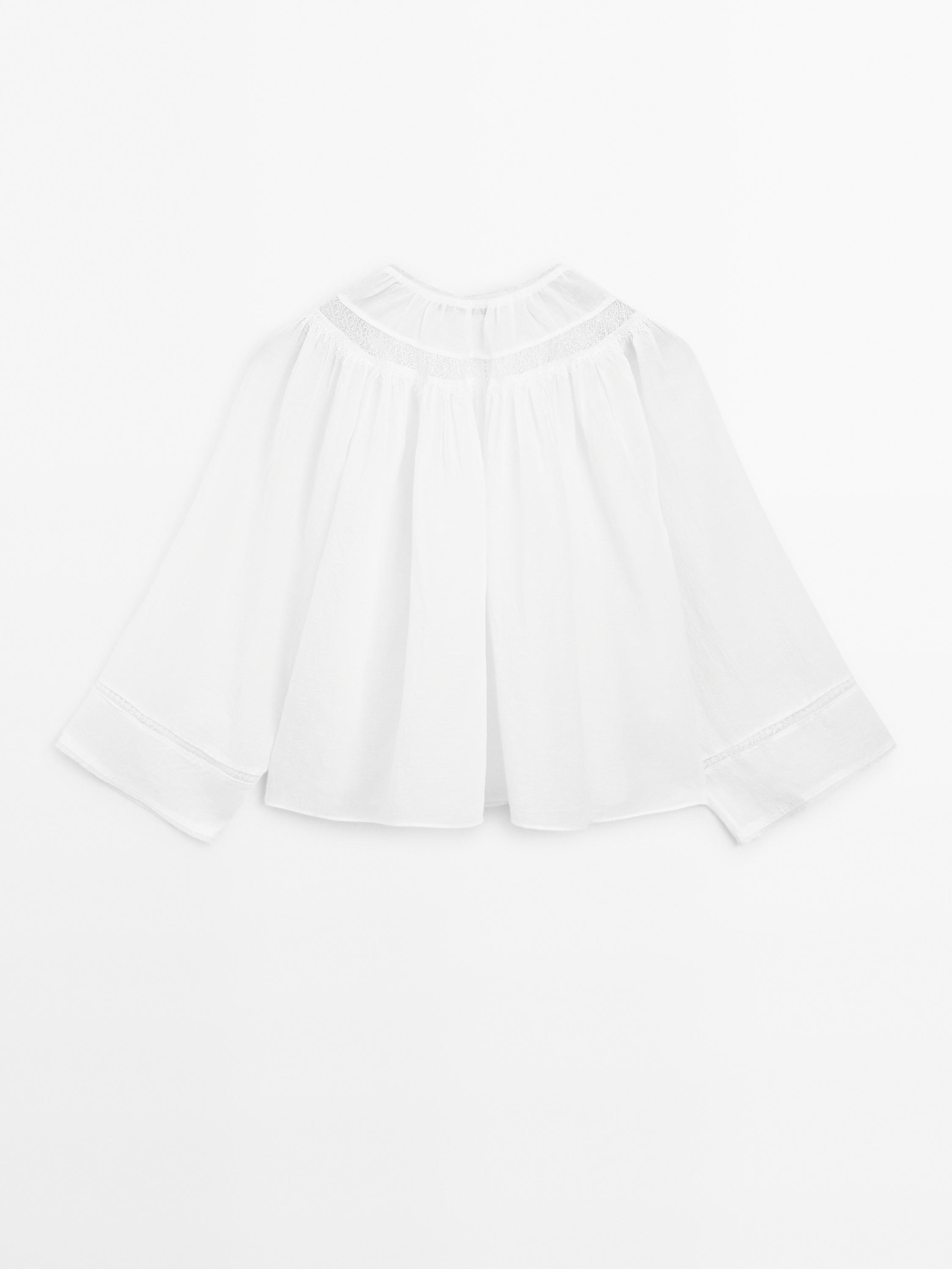 Flowing blouse with lace detail