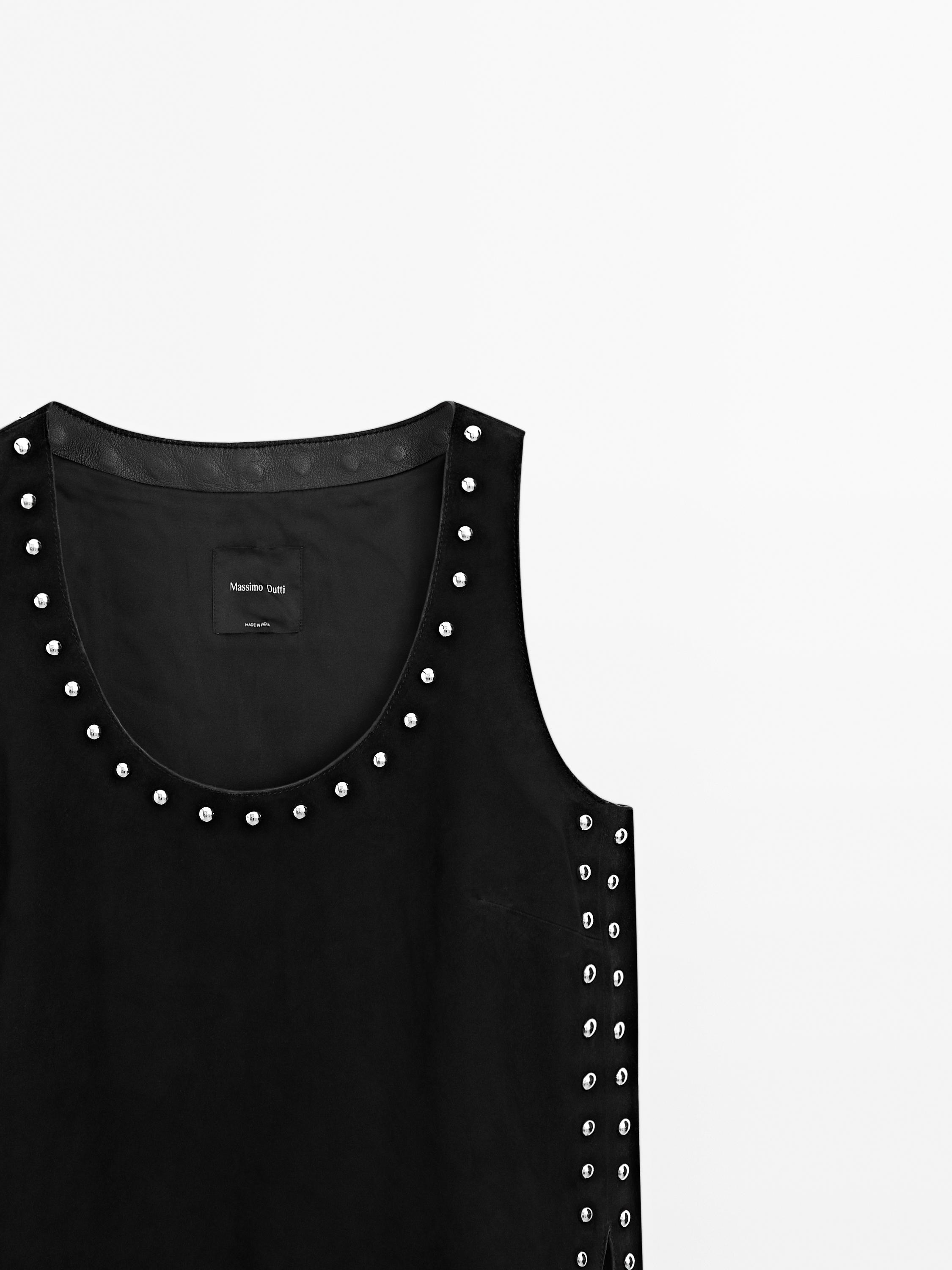 Top en cuir et daim à clous