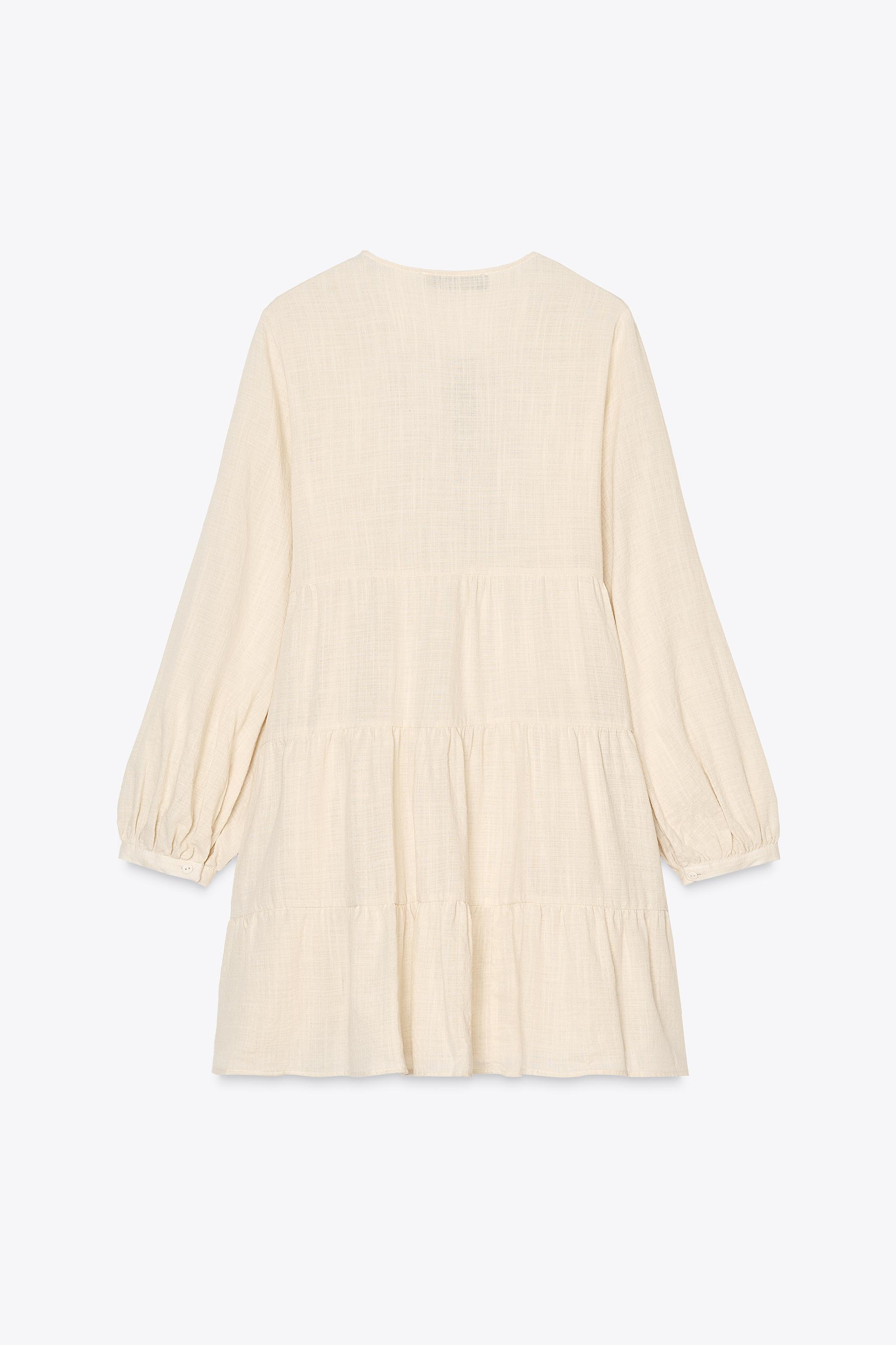 ROBE COURTE BRODERIES PANNEAUX
