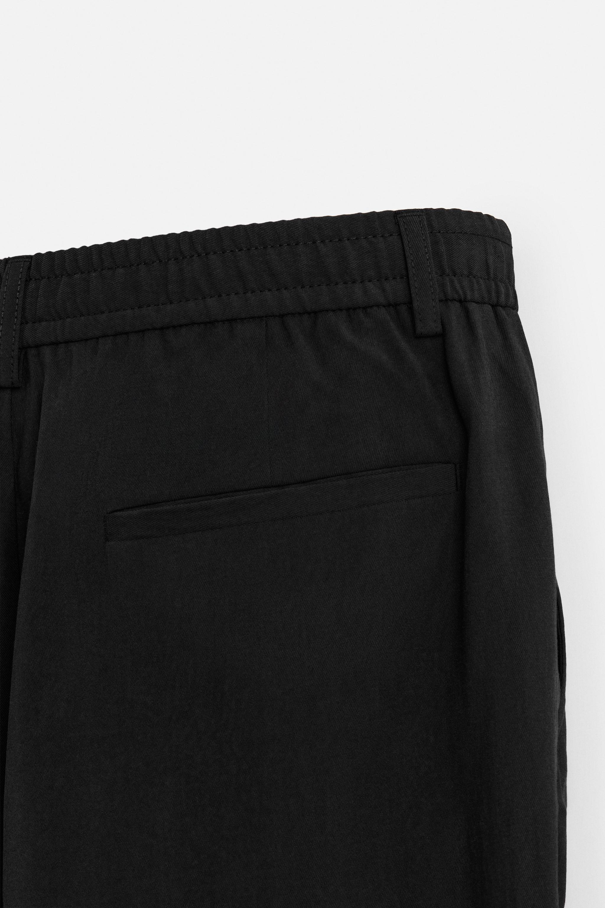 FLOWY PLEATED PANTS