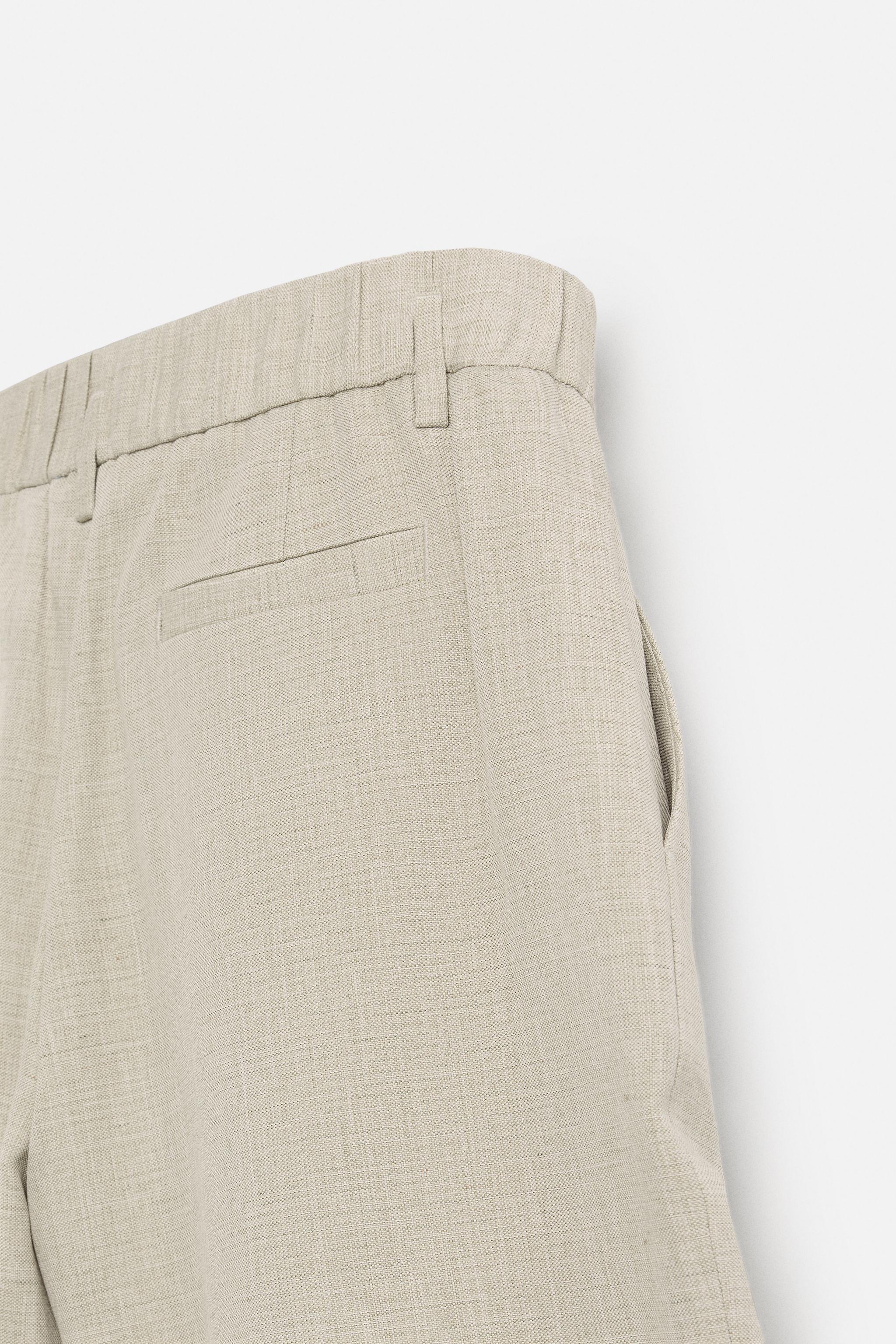 PLEATED WIDE FIT BERMUDA SHORTS
