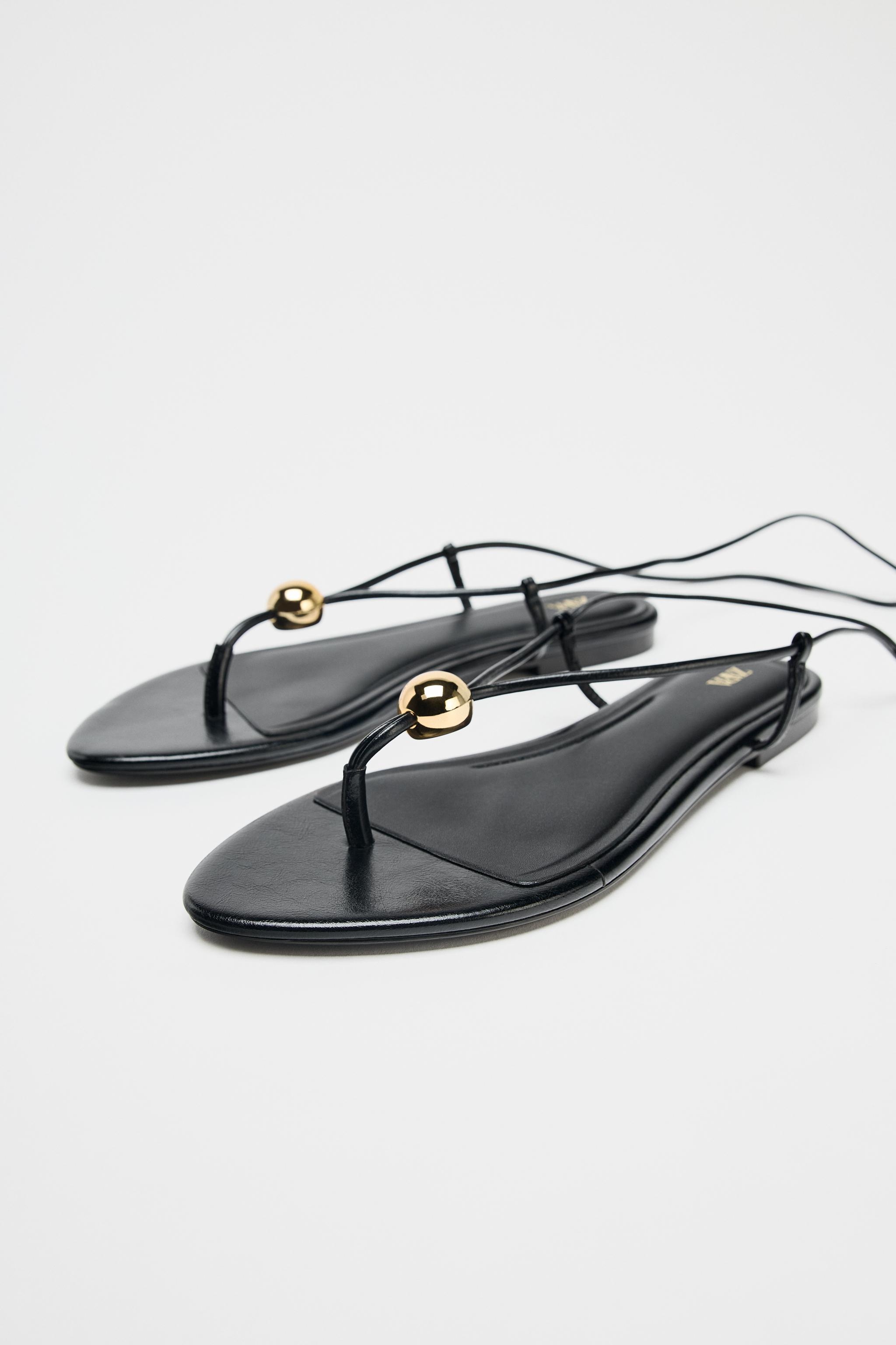 FLAT SANDALS WITH METALLIC APPLIQUÉ