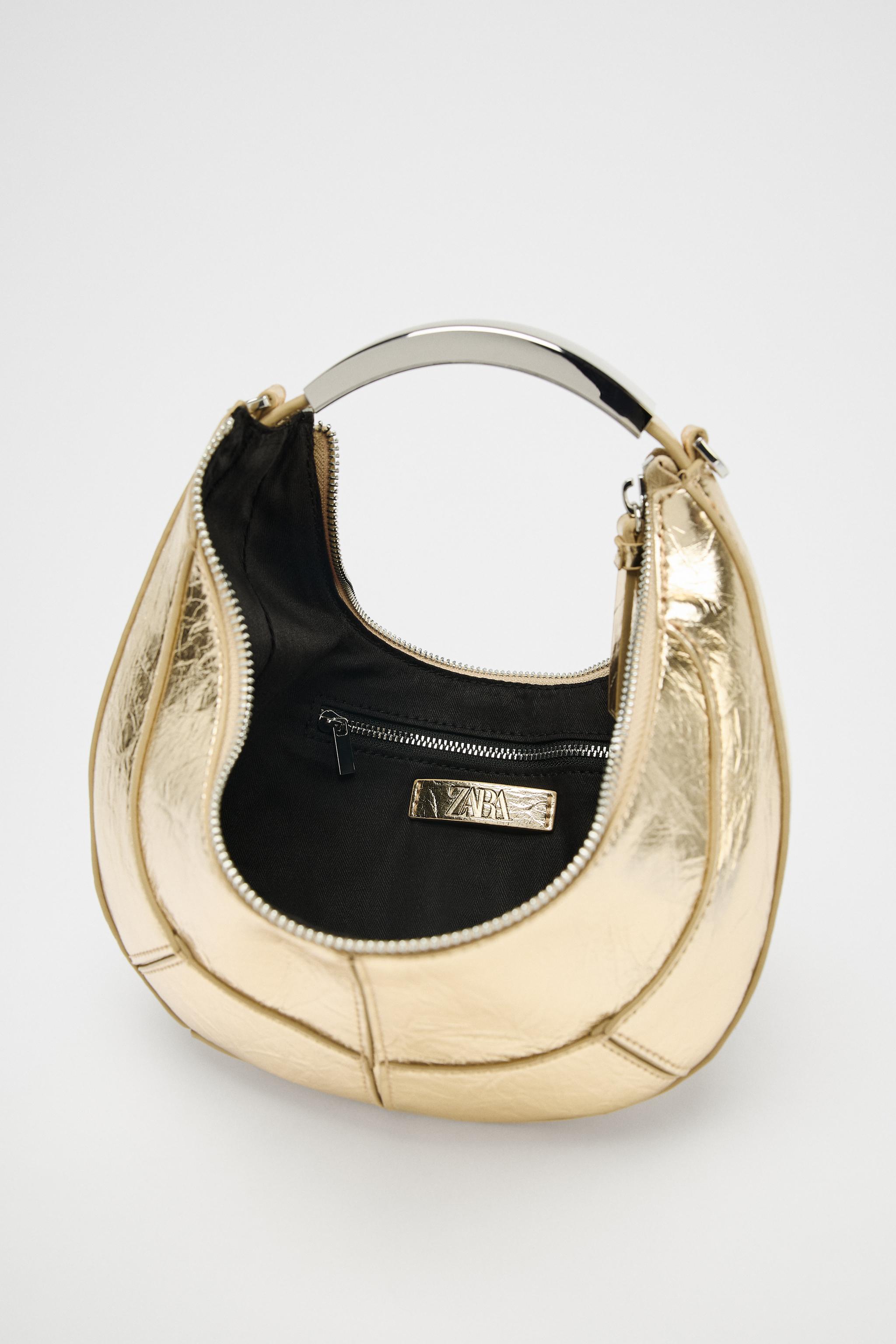 SAC OVALE AVEC ANSE MÉTALLIQUE