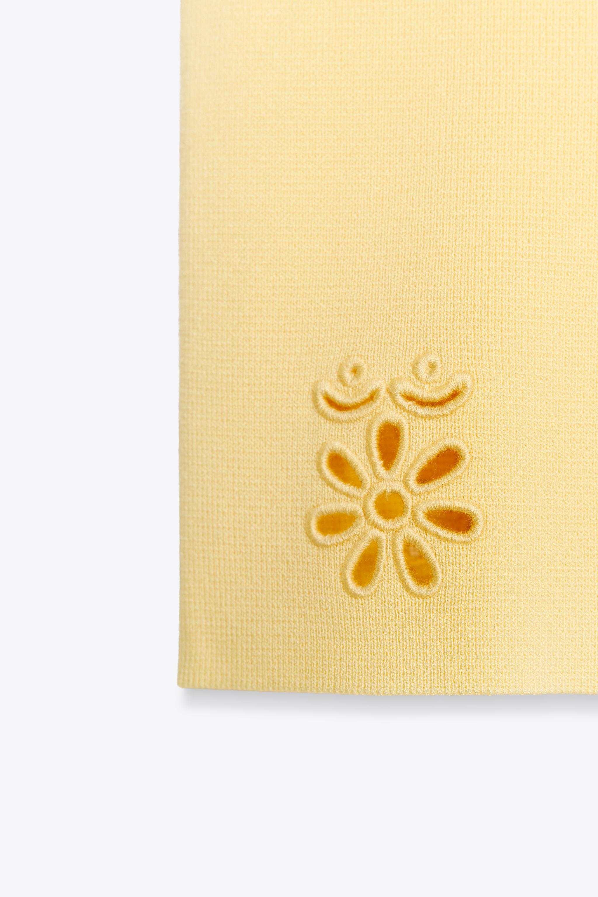 EMBROIDERED EYELET KNIT TOP