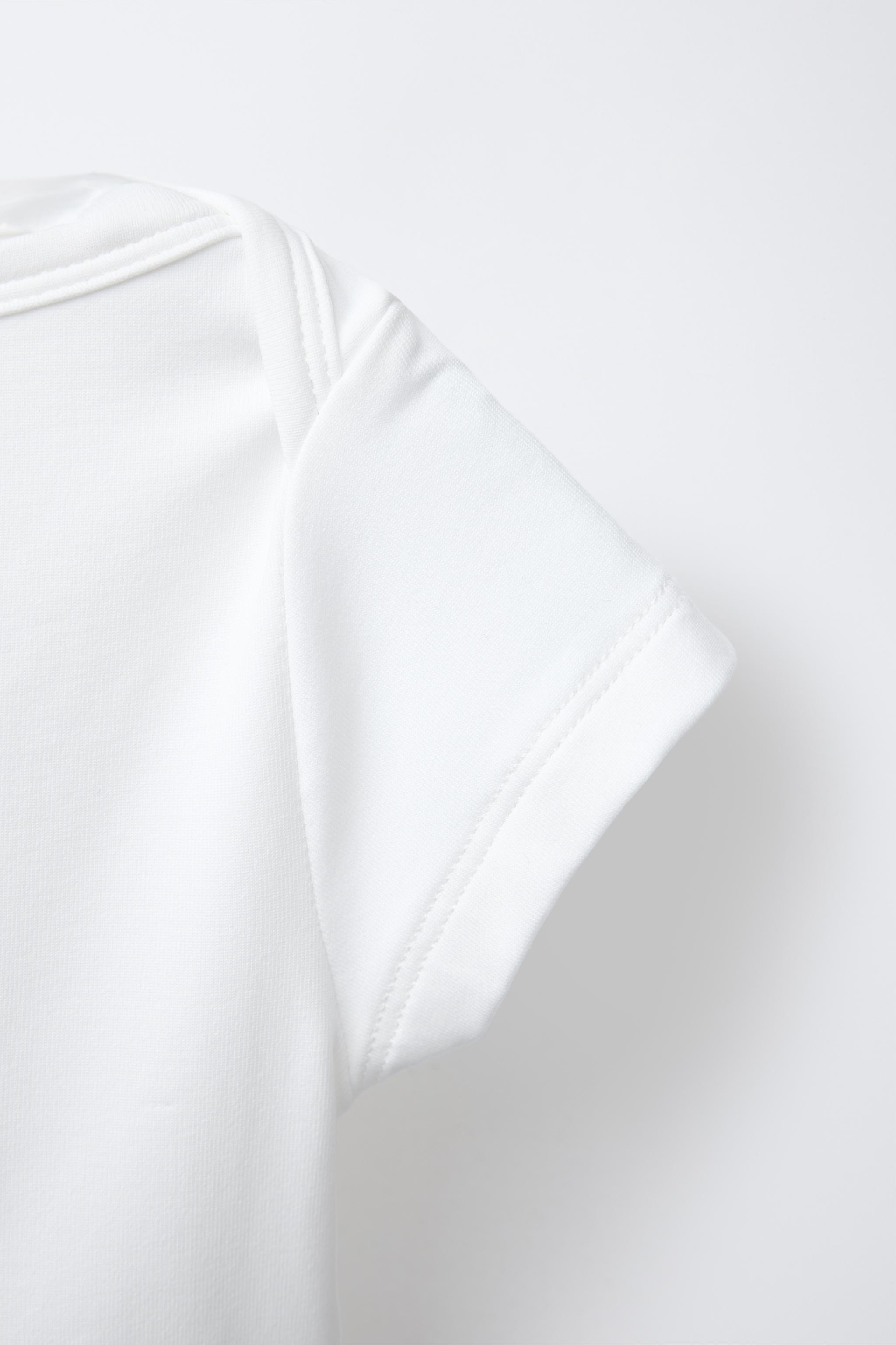 TOP CROPPED UNI ÉLASTIQUE