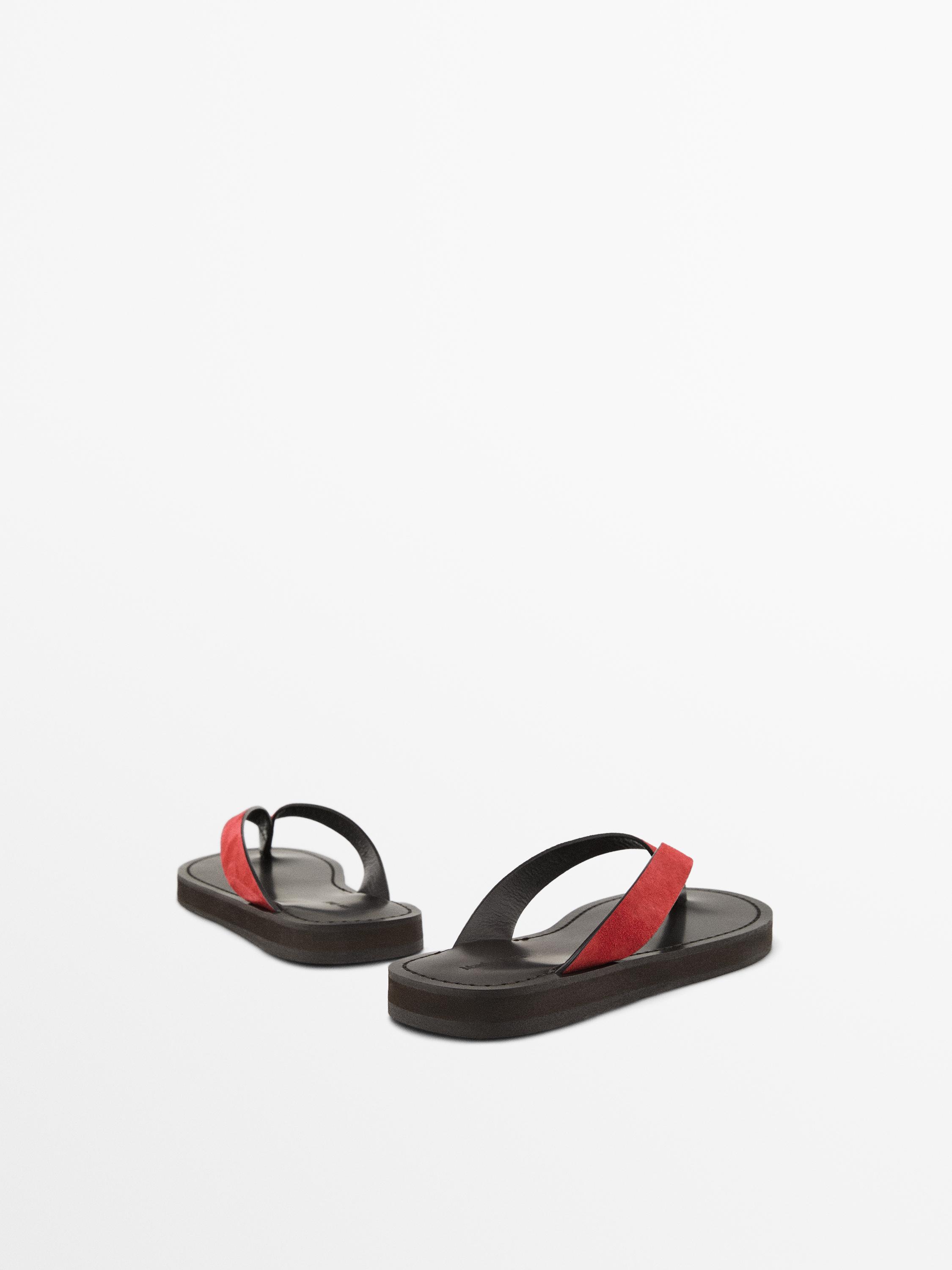 Split suede sandals with toe divider