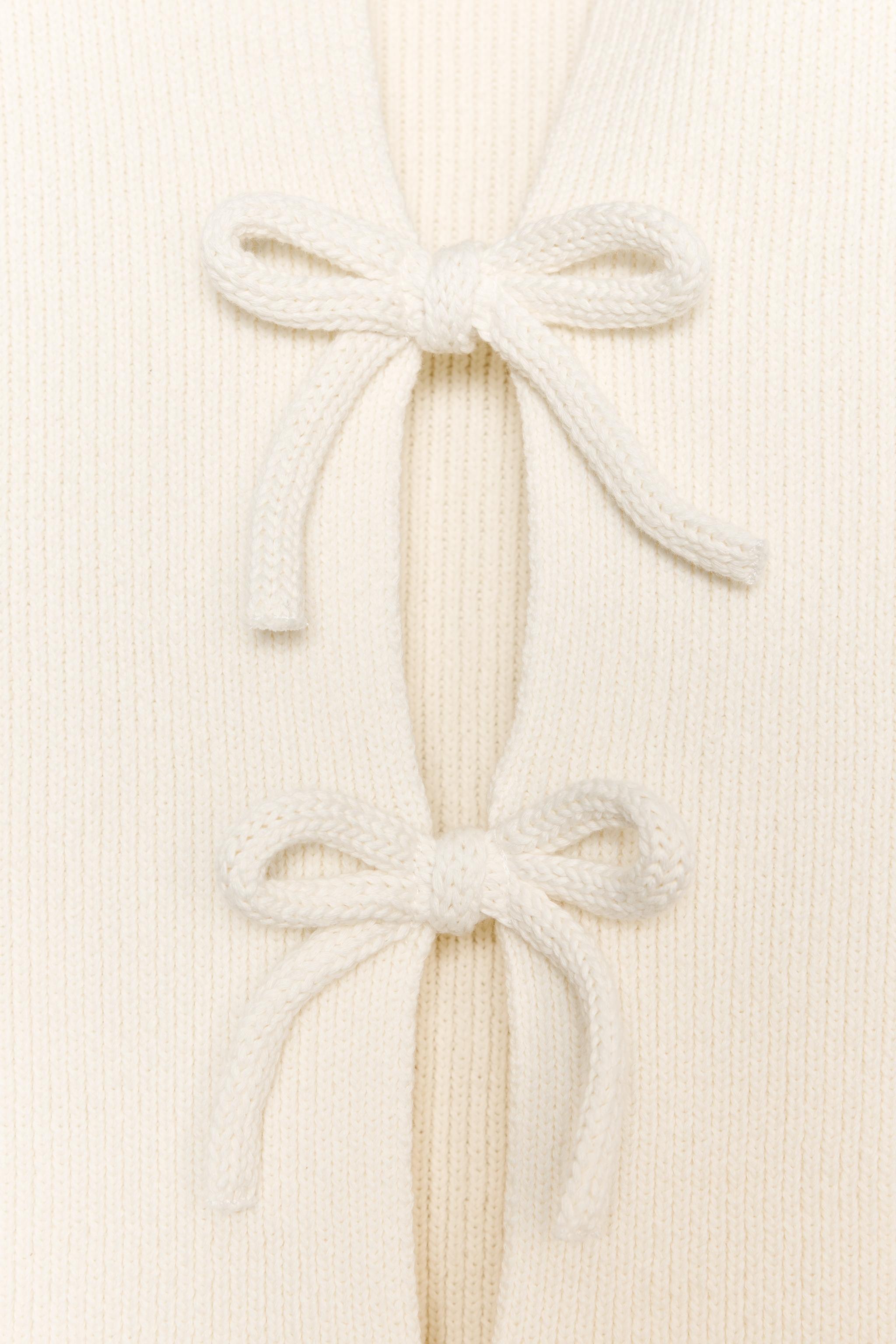 KNIT TOP WITH BOWS