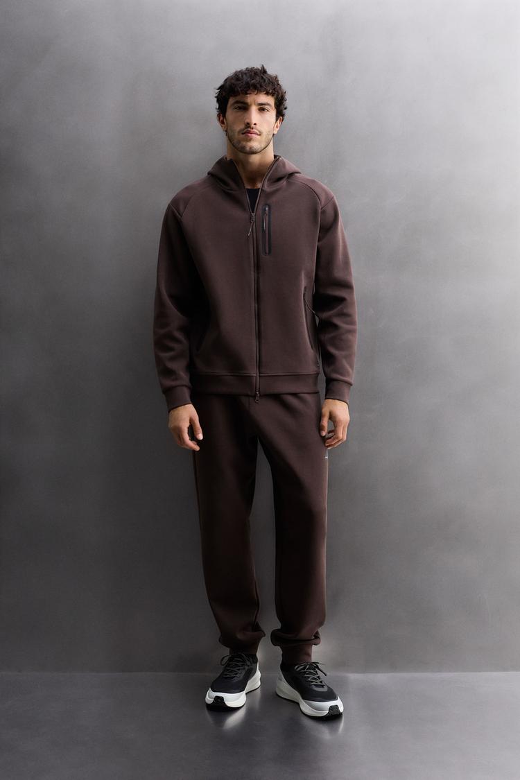 TECHNICAL PANTS WITH ZIPPERS
