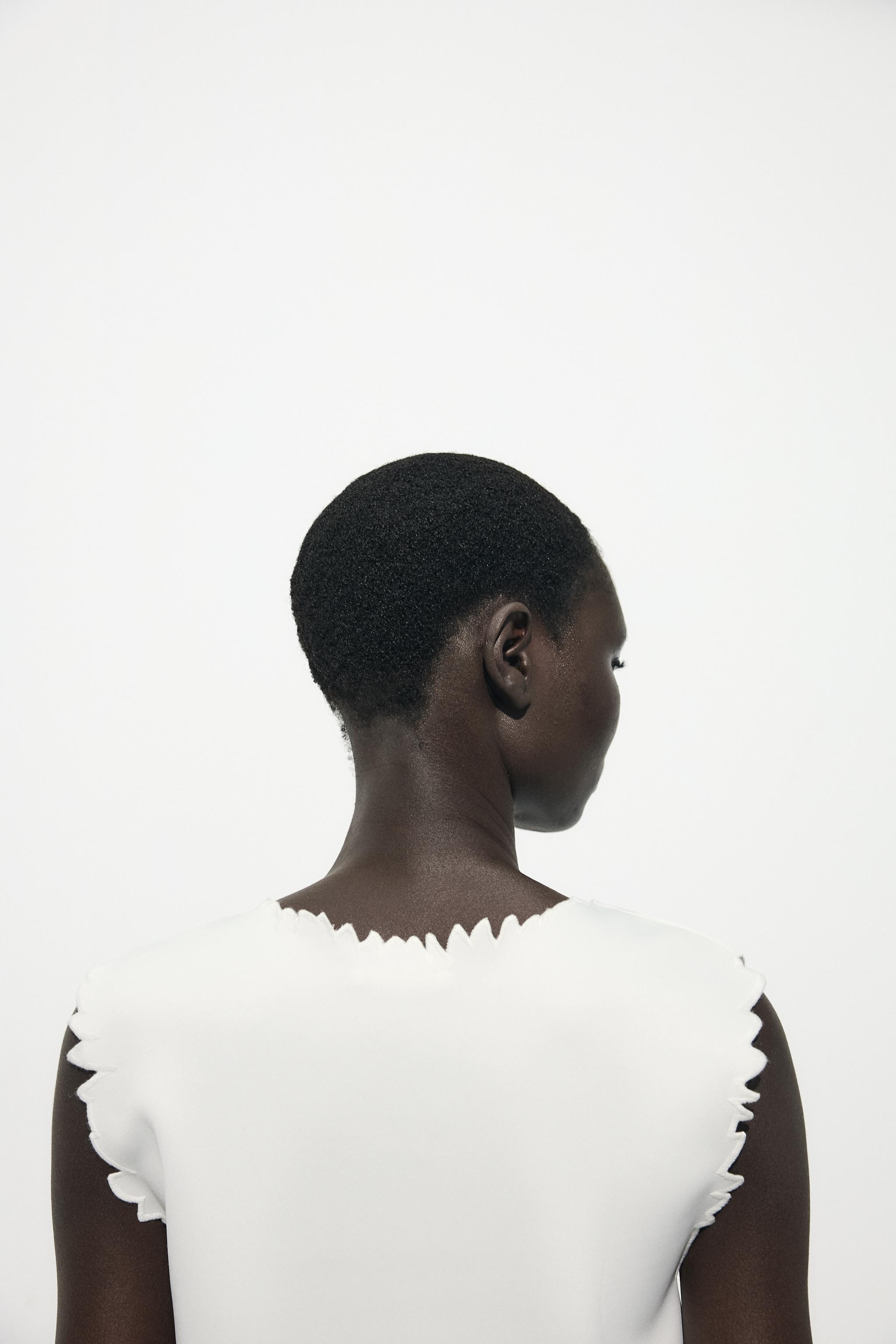 EMBROIDERED INTERLOCK TOP