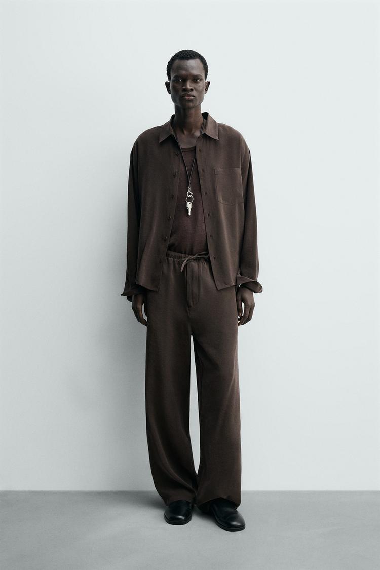 RELAXED FIT FLOWY PANTS - Zara product image