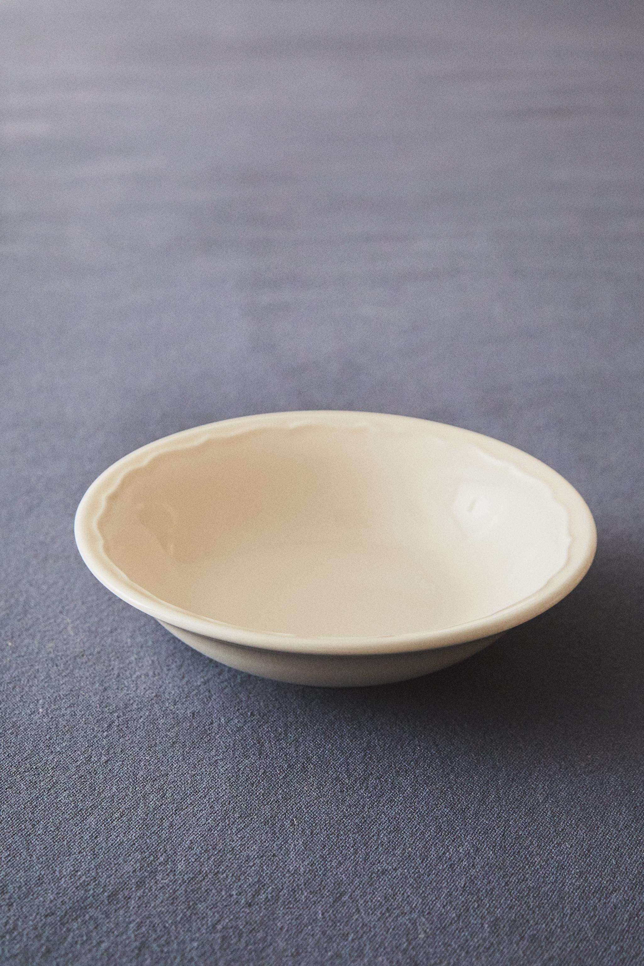 EARTHENWARE BOWL WITH RAISED-DESIGN EDGE