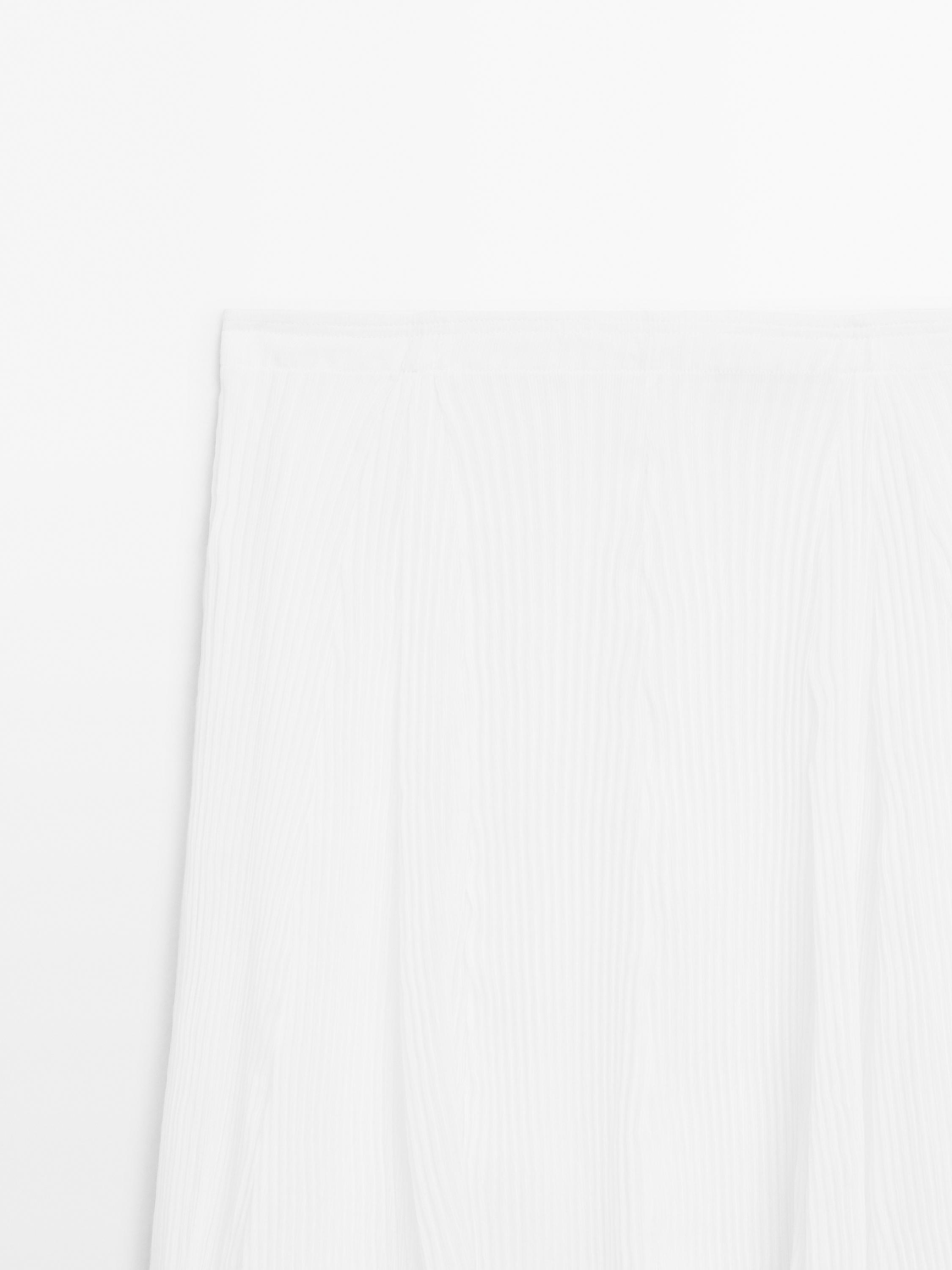 Pleated skirt with godet detail