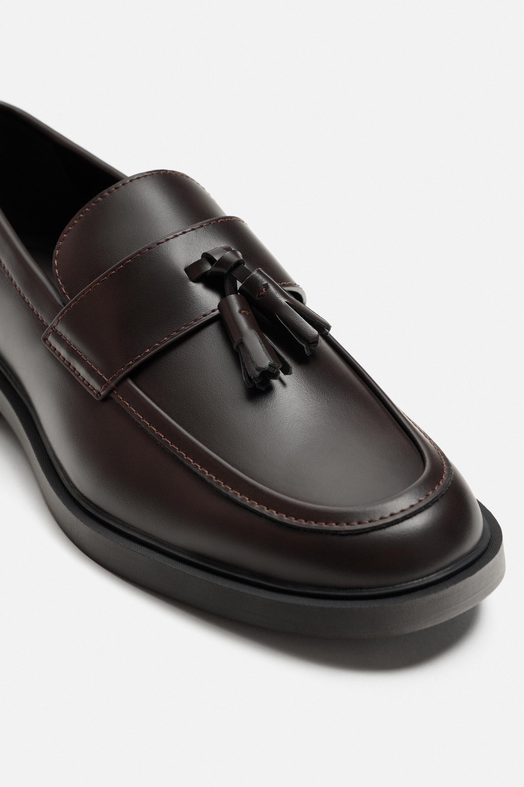 MOCASSINS CHICS À POMPONS