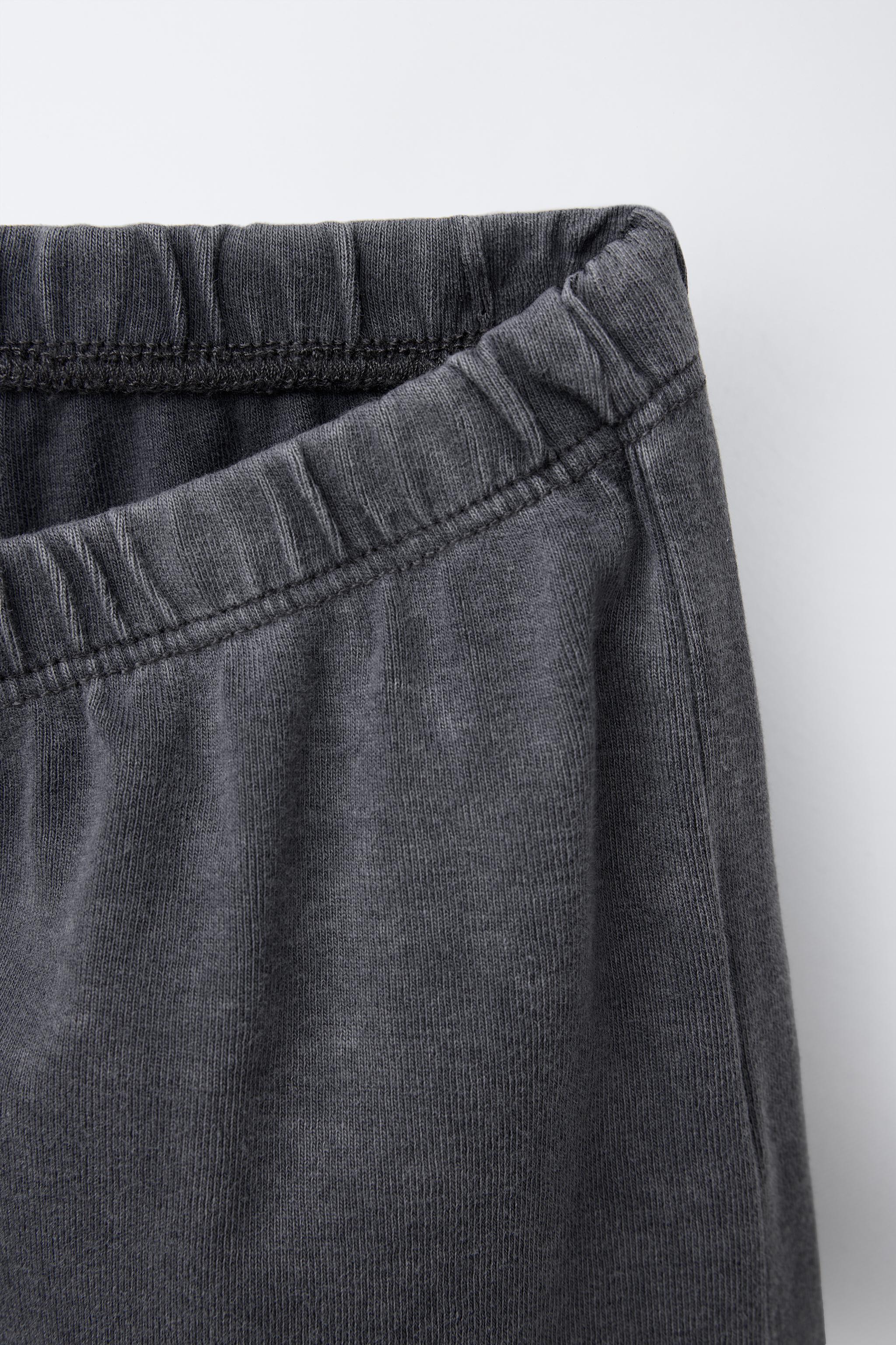 WASHED EFFECT STUDDED BERMUDA SHORTS