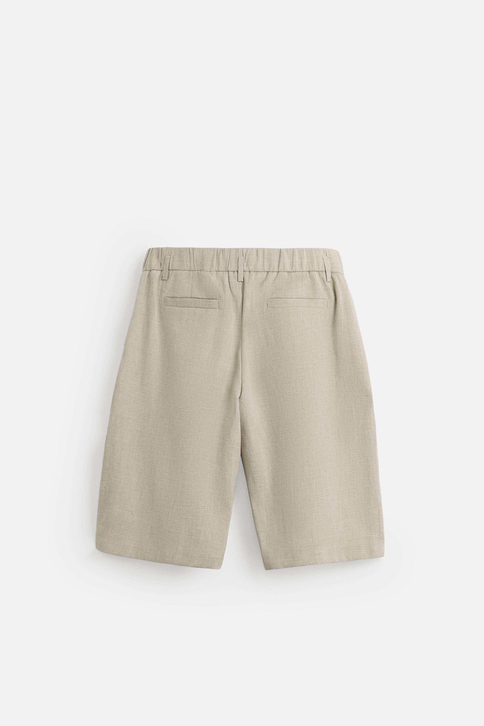 PLEATED WIDE FIT BERMUDA SHORTS